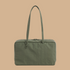 A green nylon shoulder bag. 