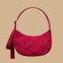 A red bag that can be a shoulder bag or a crossbody. 