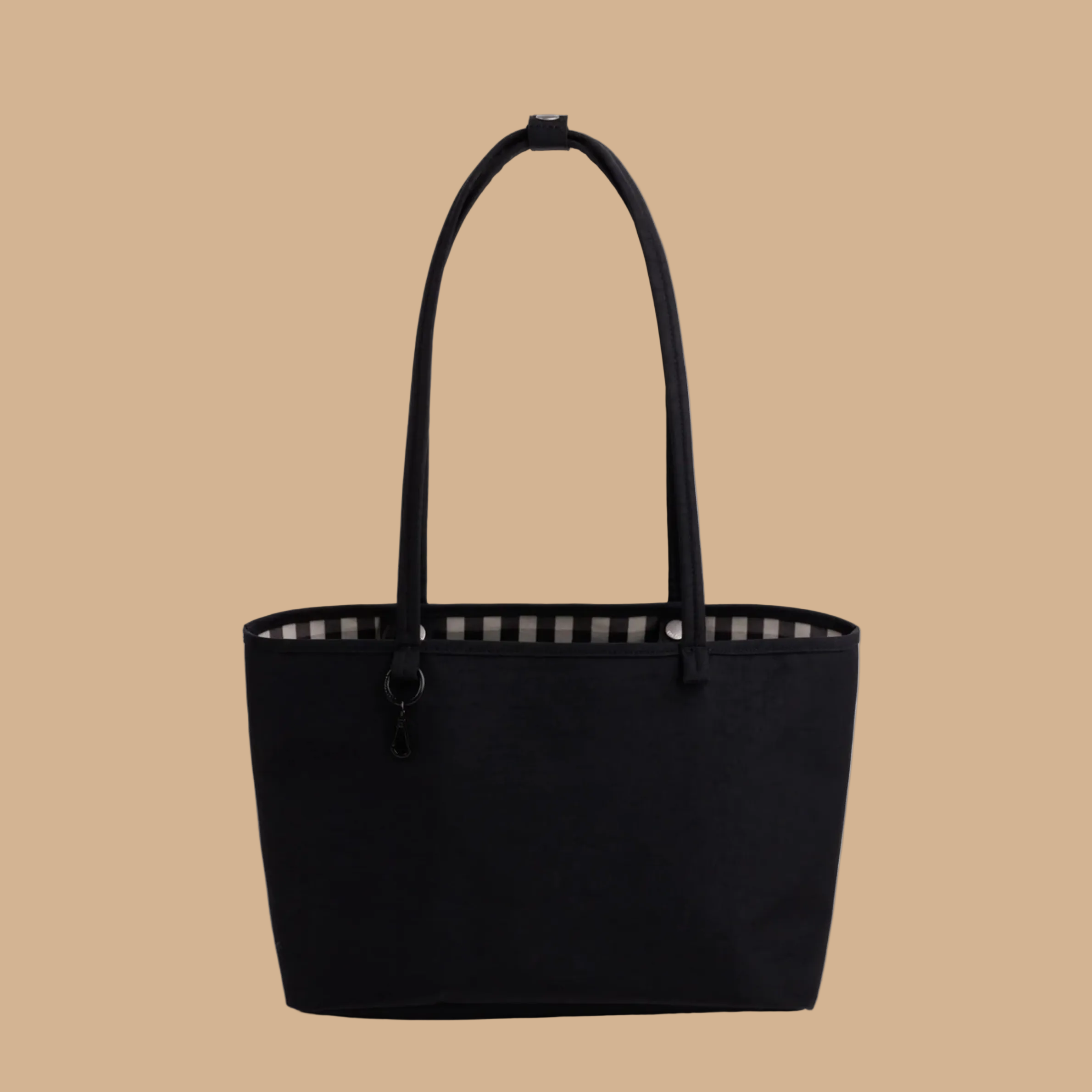 A black and black and white checkered reversible tote bag. 