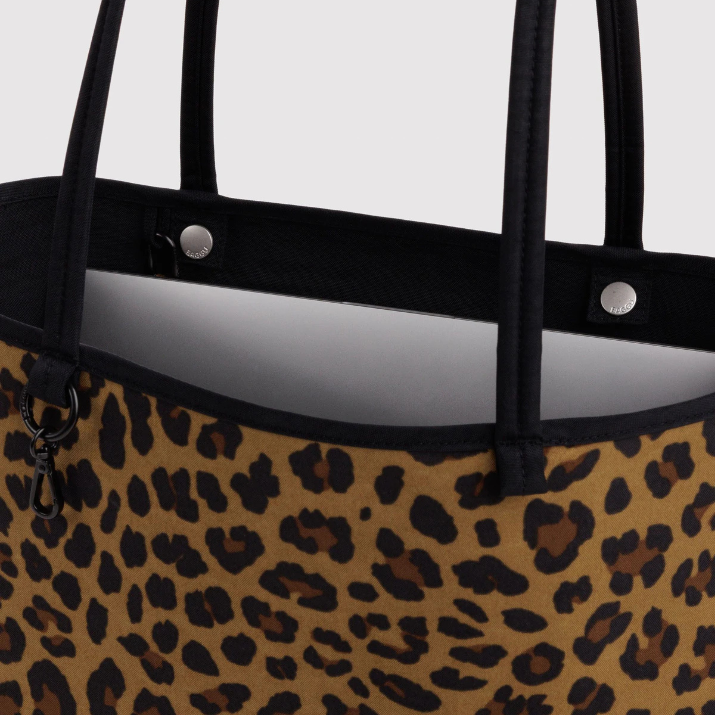 A black and leopard reversible tote.