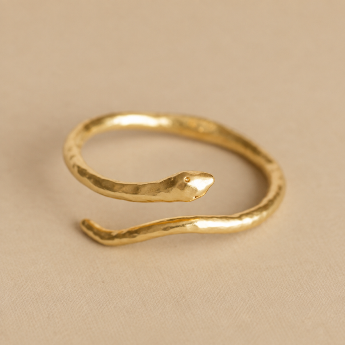 a snake shaped cuff bracelet. 