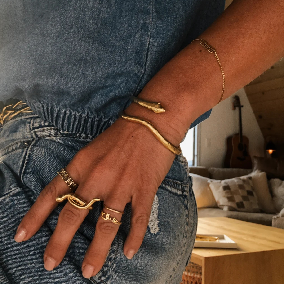 a snake shaped cuff bracelet. 