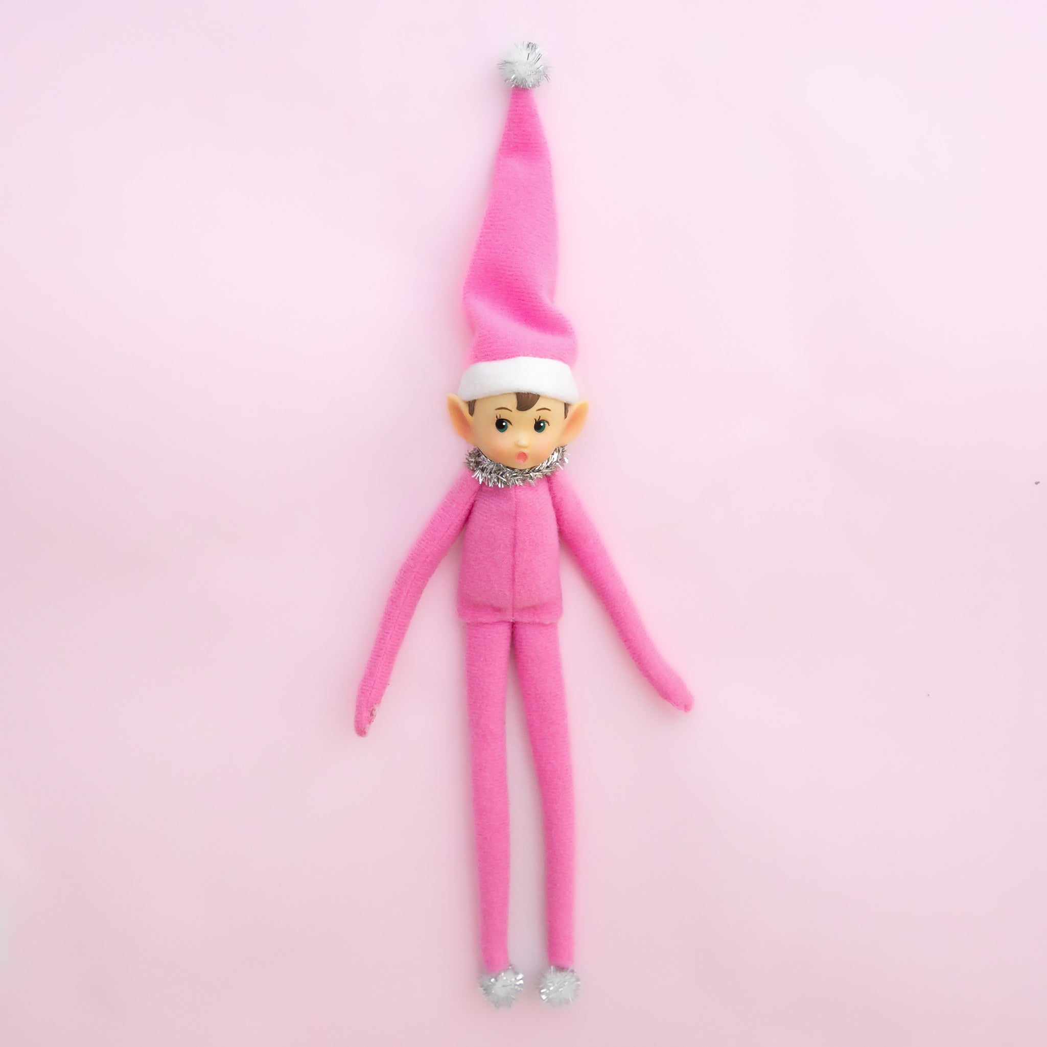 A pink elf shaped ornament. 