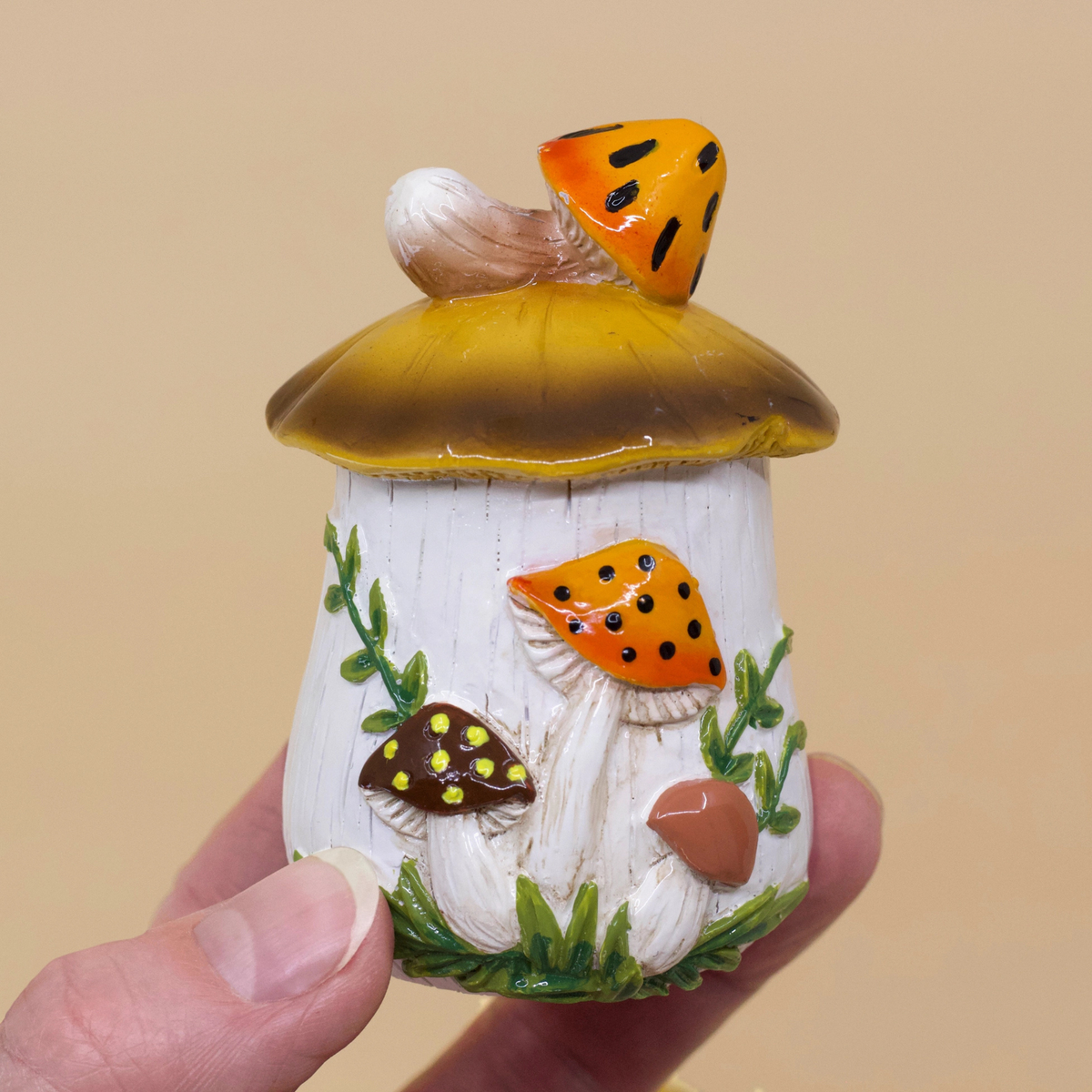 a set of hand painted mushroom trinket dishes.