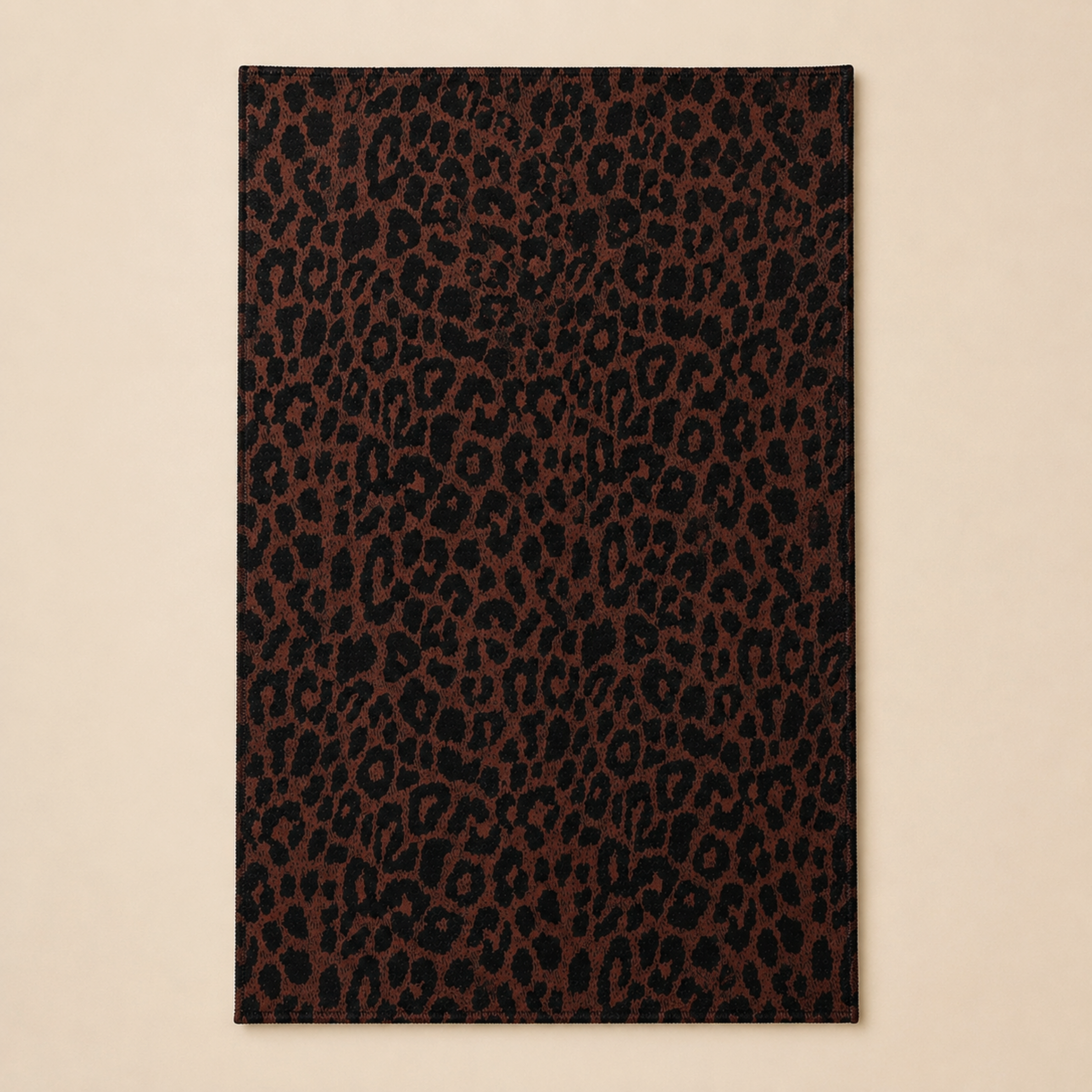 A brown and black leopard towel. 