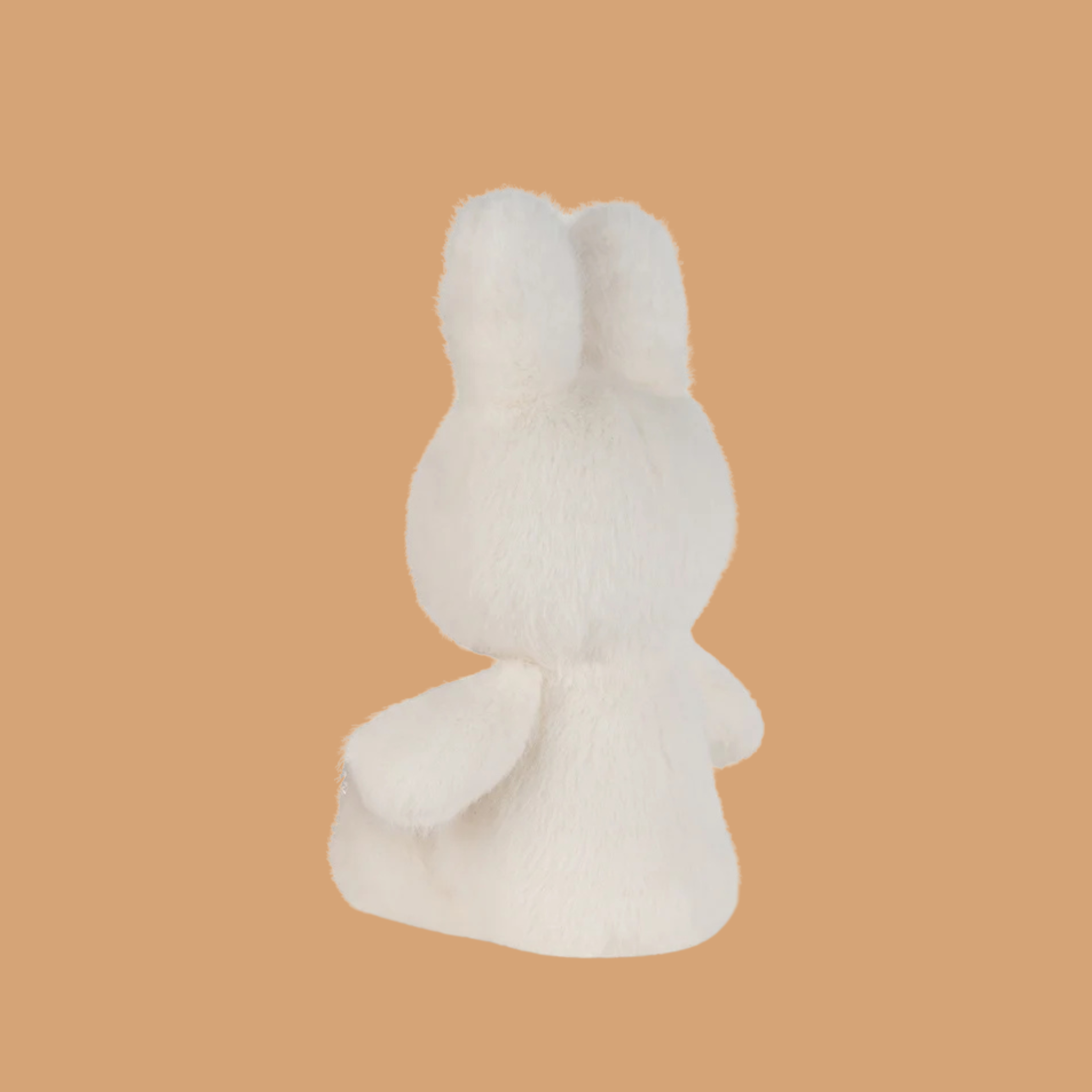 a white miffy shaped stuffed toy. 