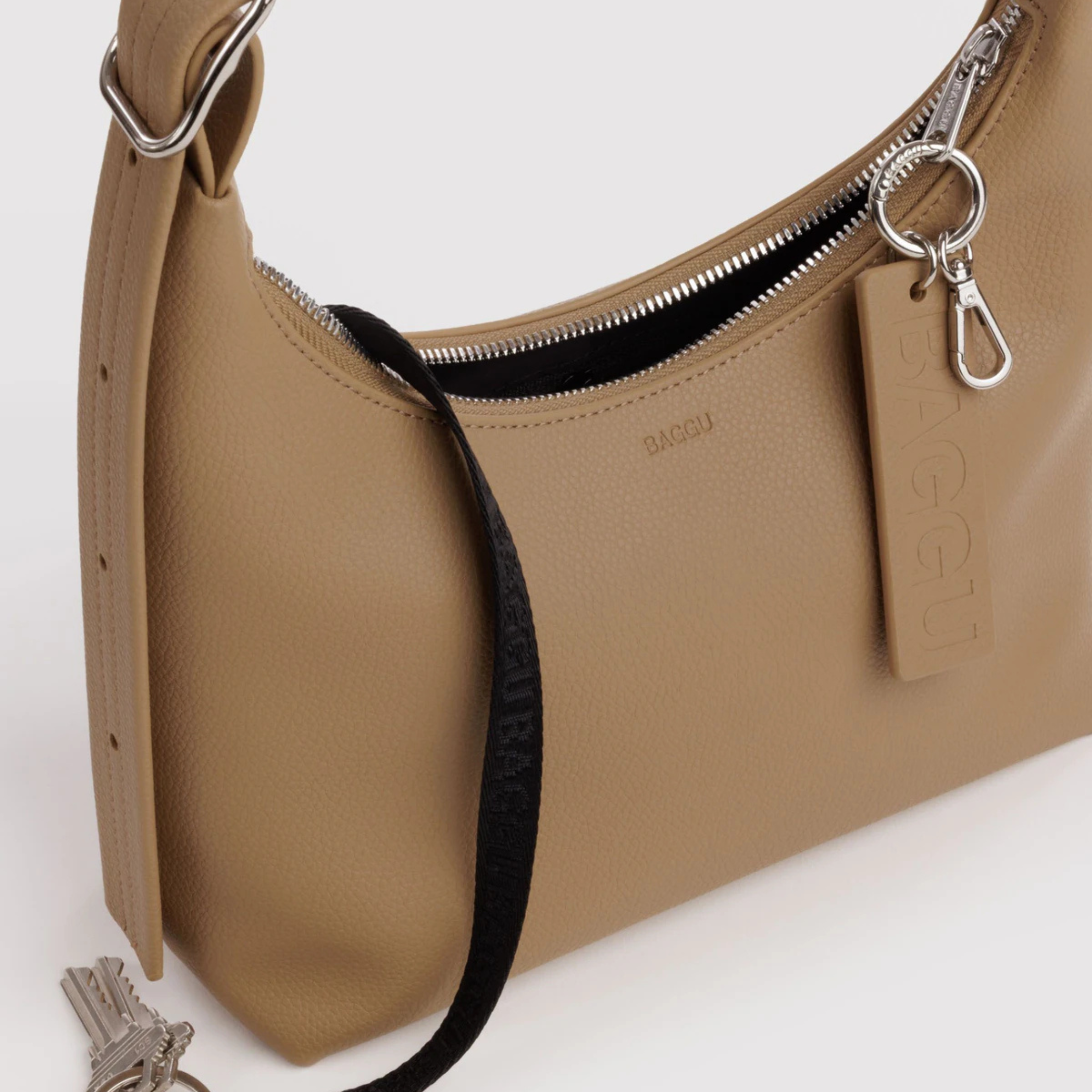 A small tan leather shoulder bag. 