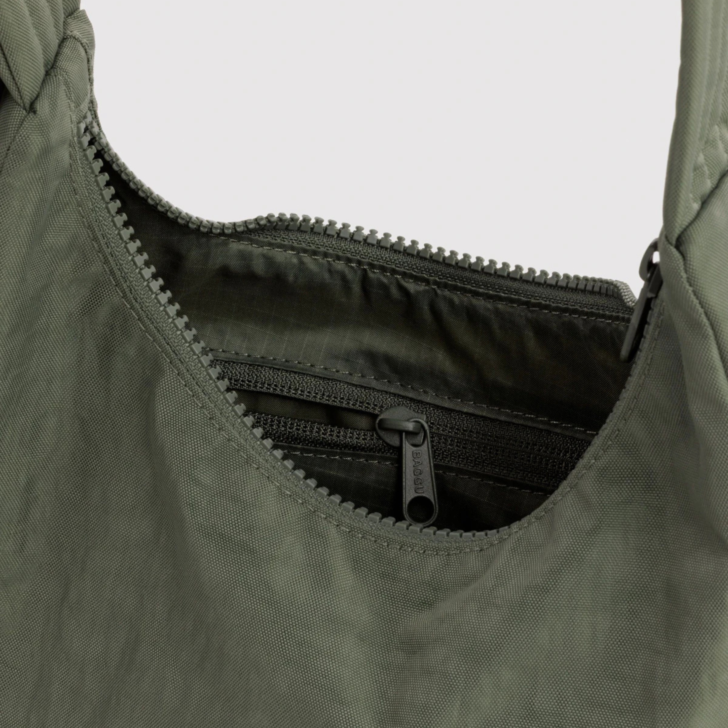 A green nylon mini bag purse.