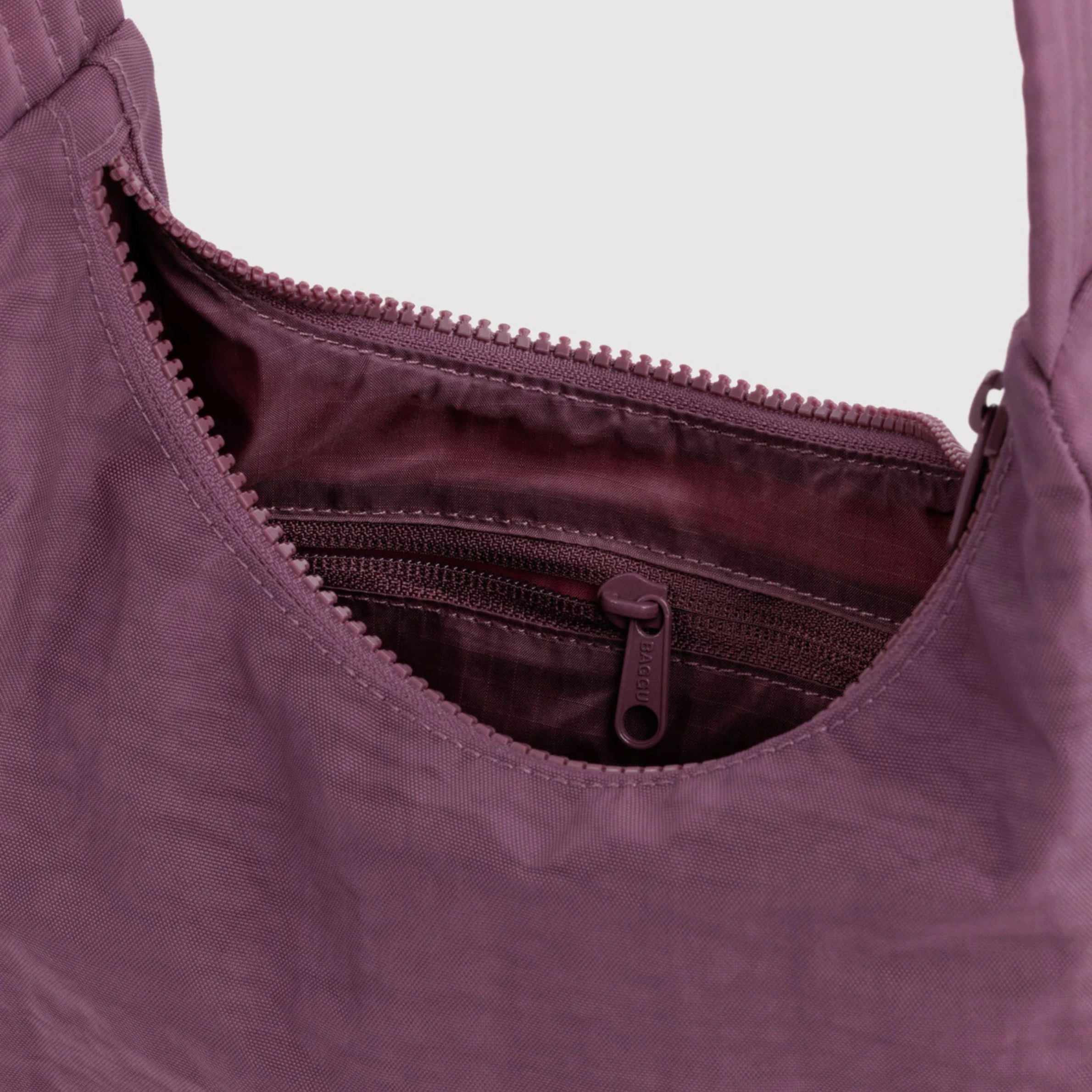 A purple nylon mini handbag.