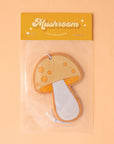 A yellow and orange mushroom shaped air freshener.