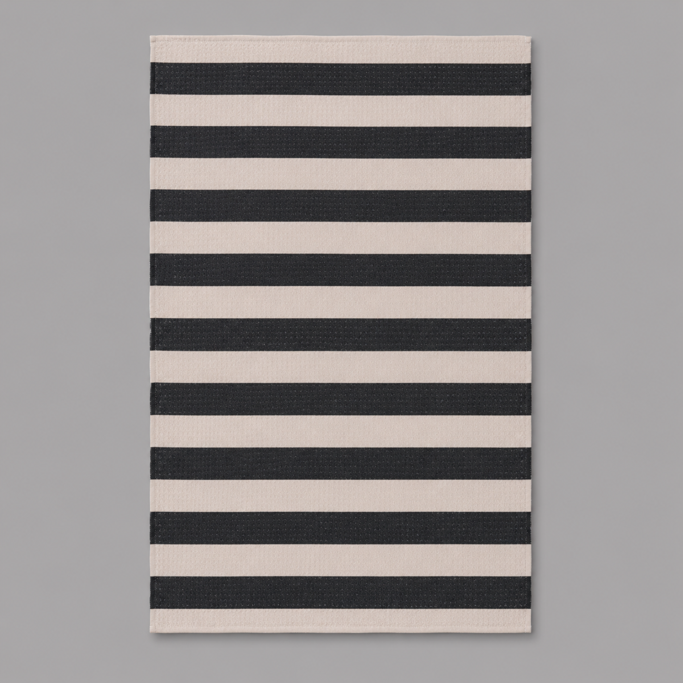 a cream and black striped towel. 