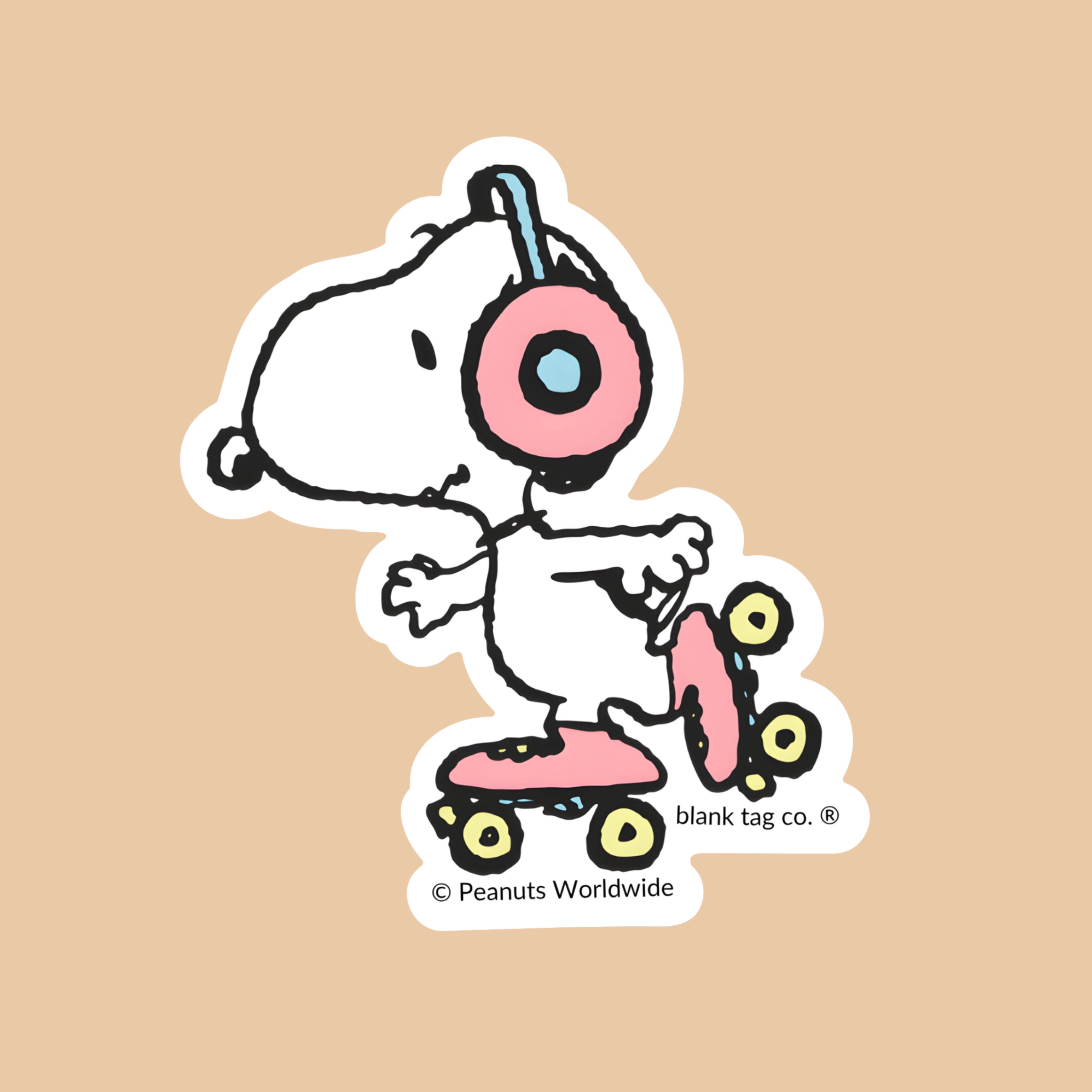 a snoopy shaped sticker wearing roller skates.