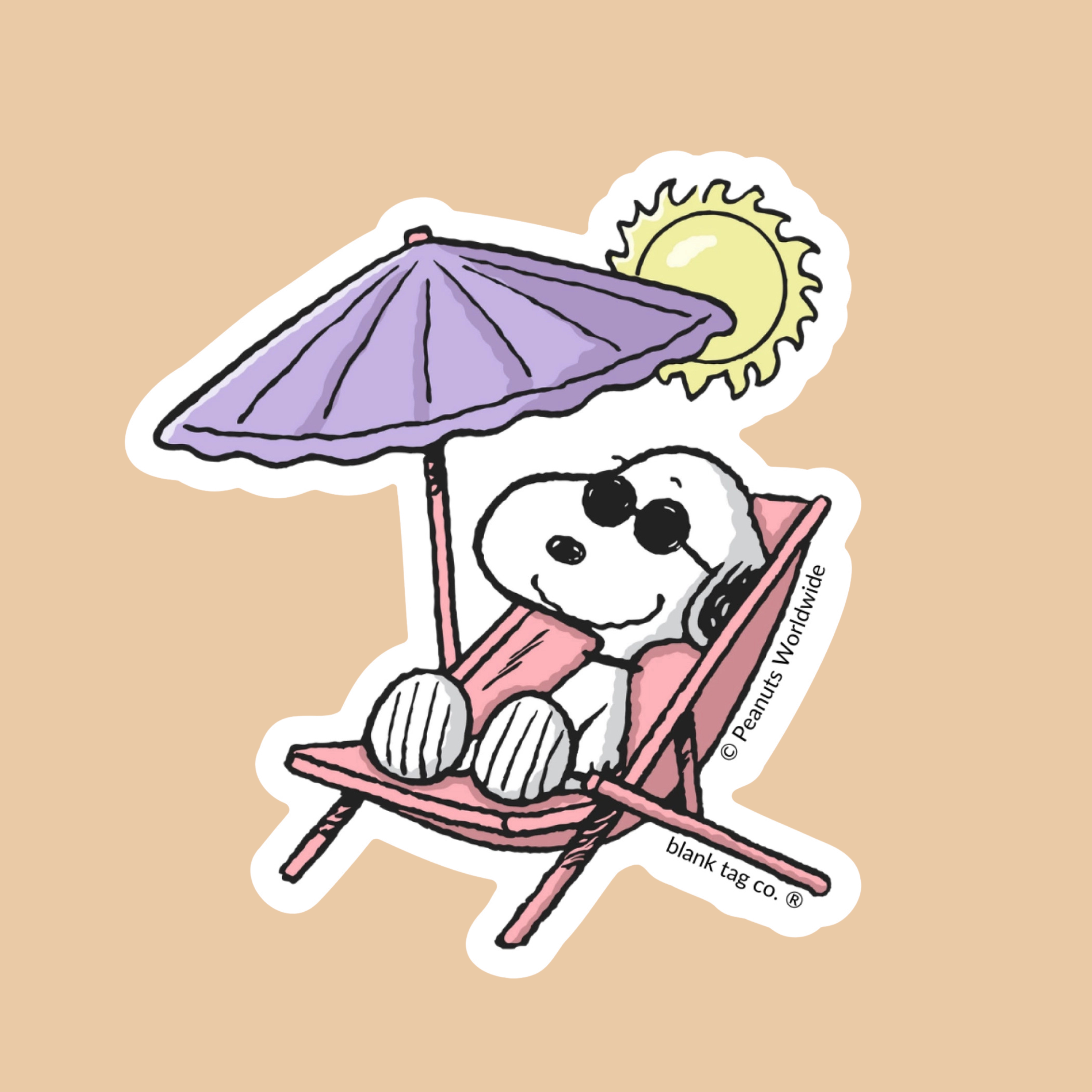 a snoopy shaped sticker sitting in a sun chair.