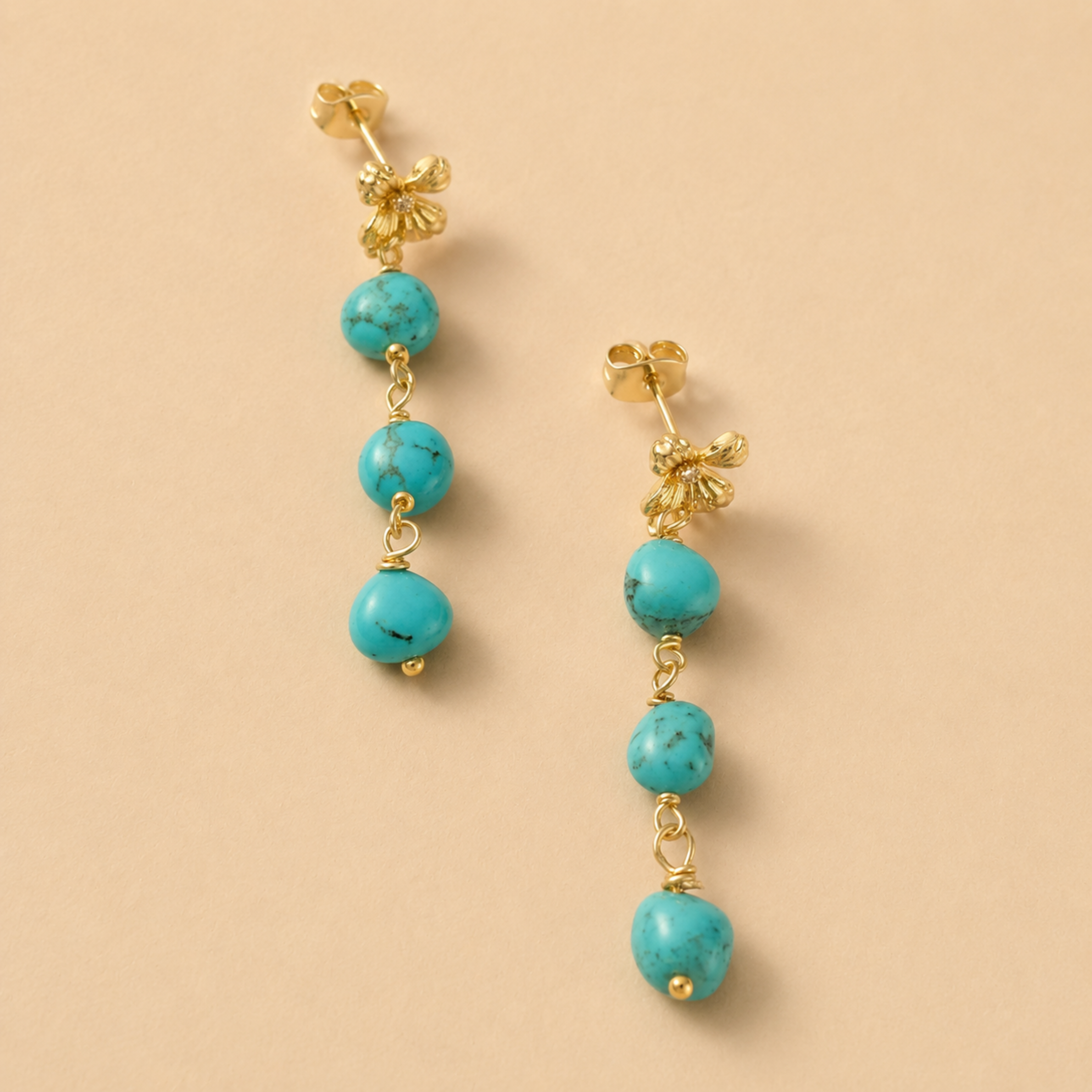 a pair of blue beaded dangle earrings. 