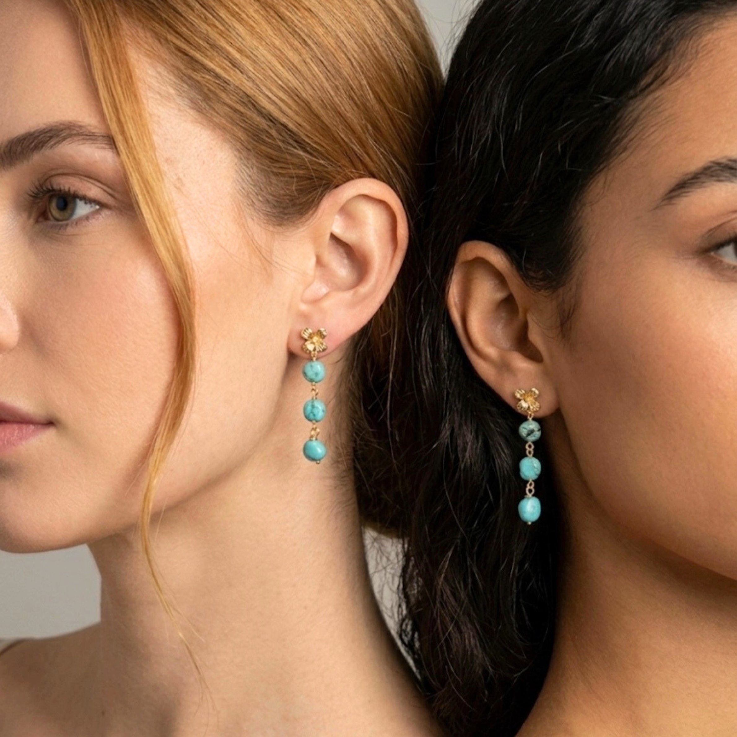 a pair of blue beaded dangle earrings. 