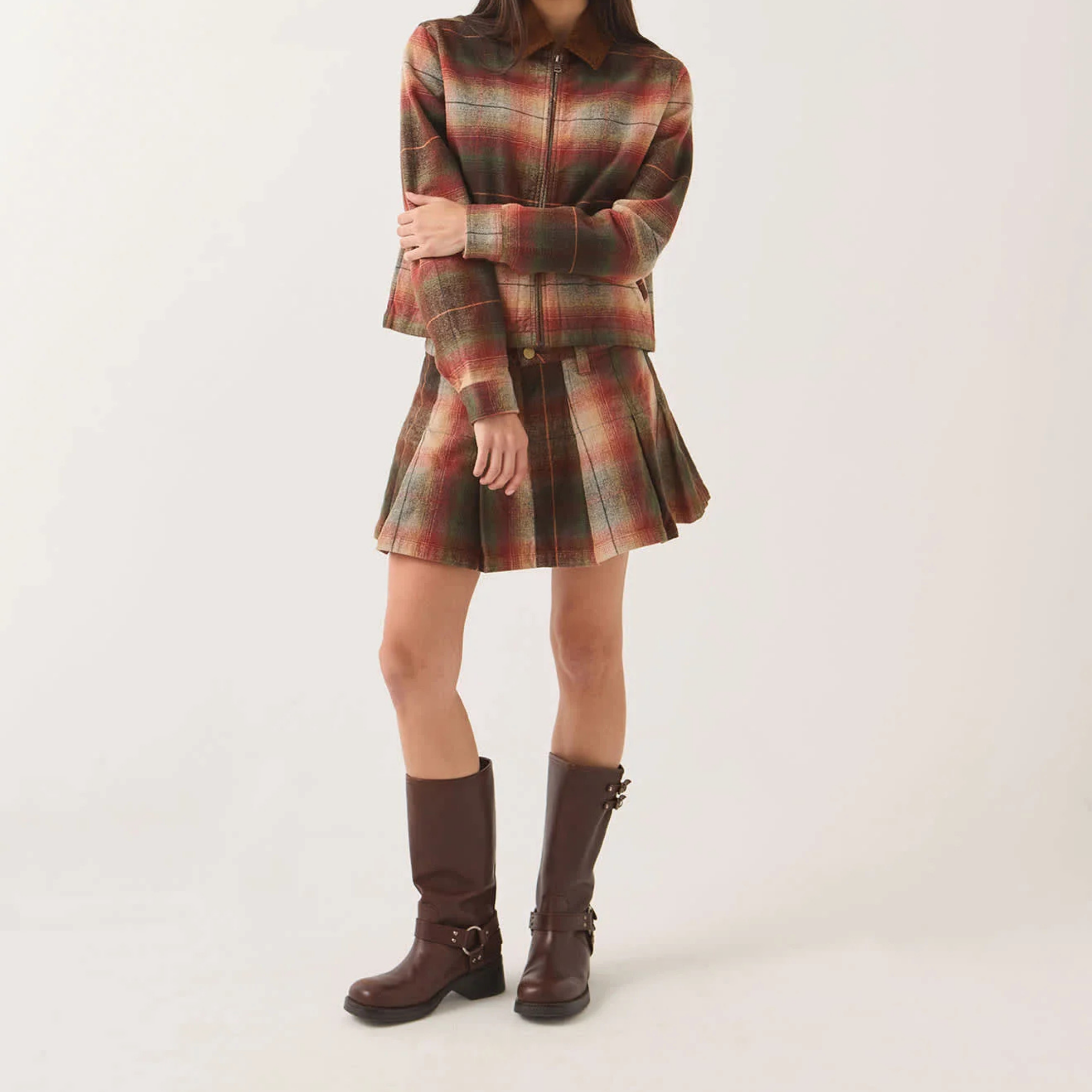 a green, red and cream pleated mini skirt. 