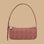 A tan and dark pinkish red patterned shoulder bag.