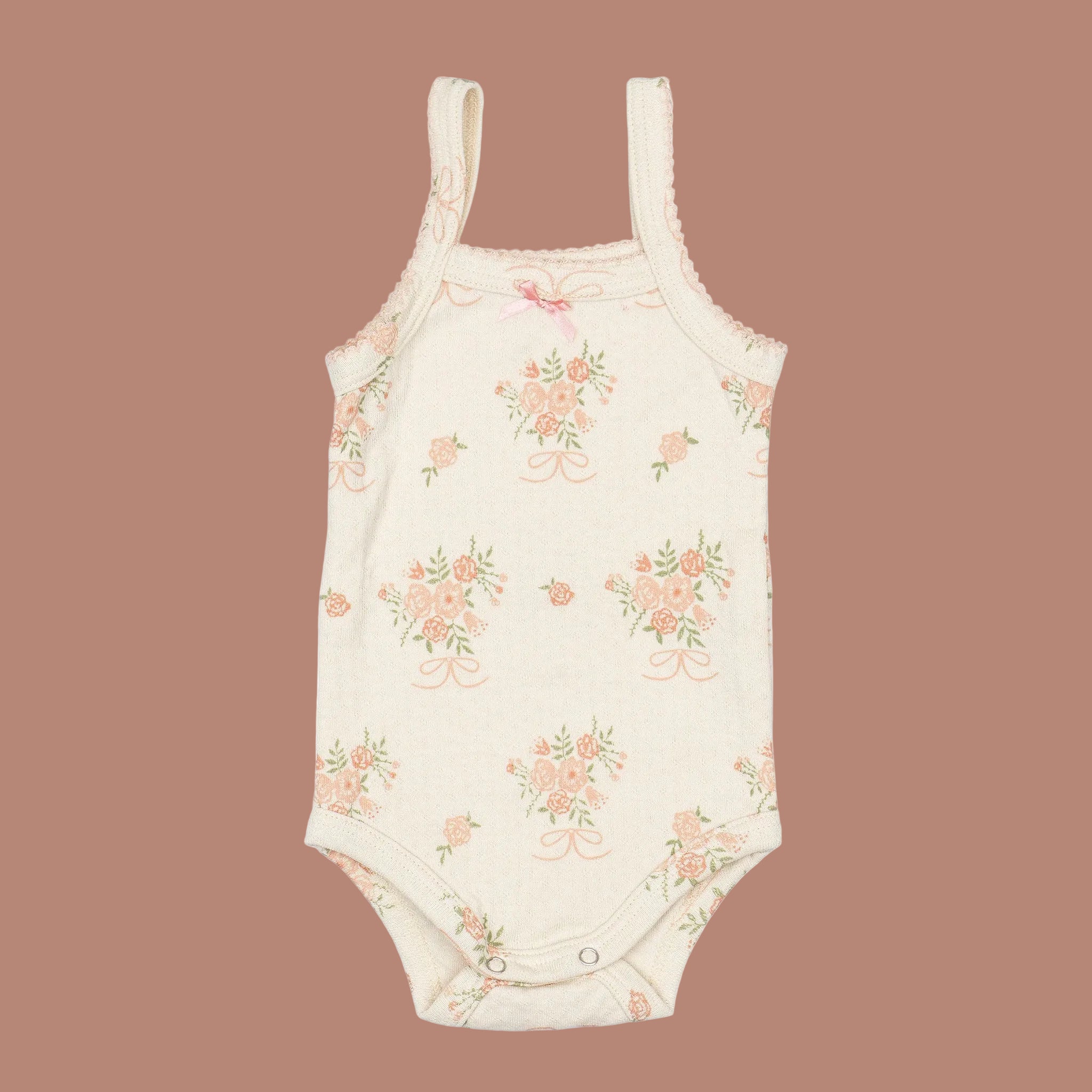 A neutral tank top onesie with a floral print. 