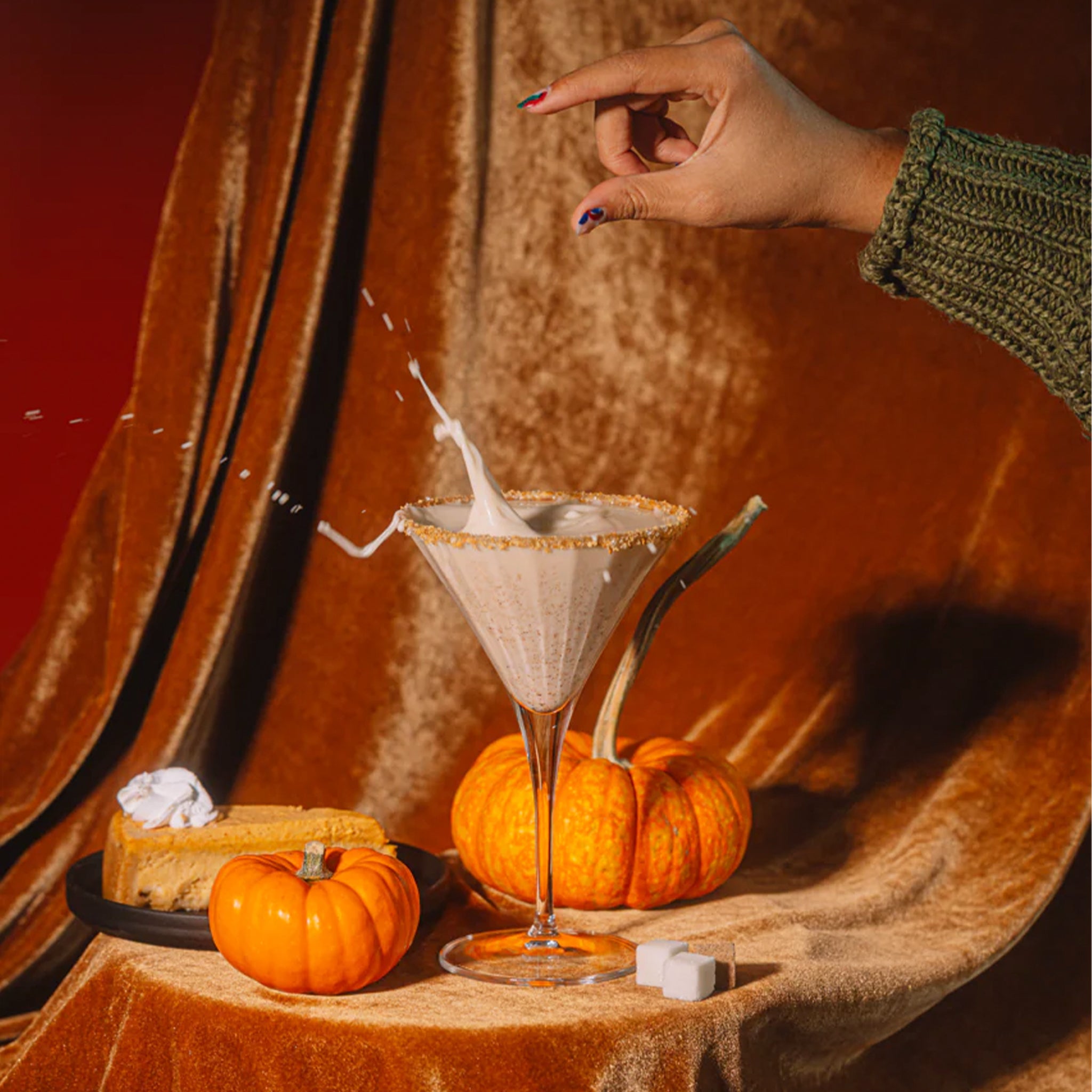 A box of a pumpkin flavored sugar cubes with text that reads, 'Pumpkin Cheesecake Martini'.