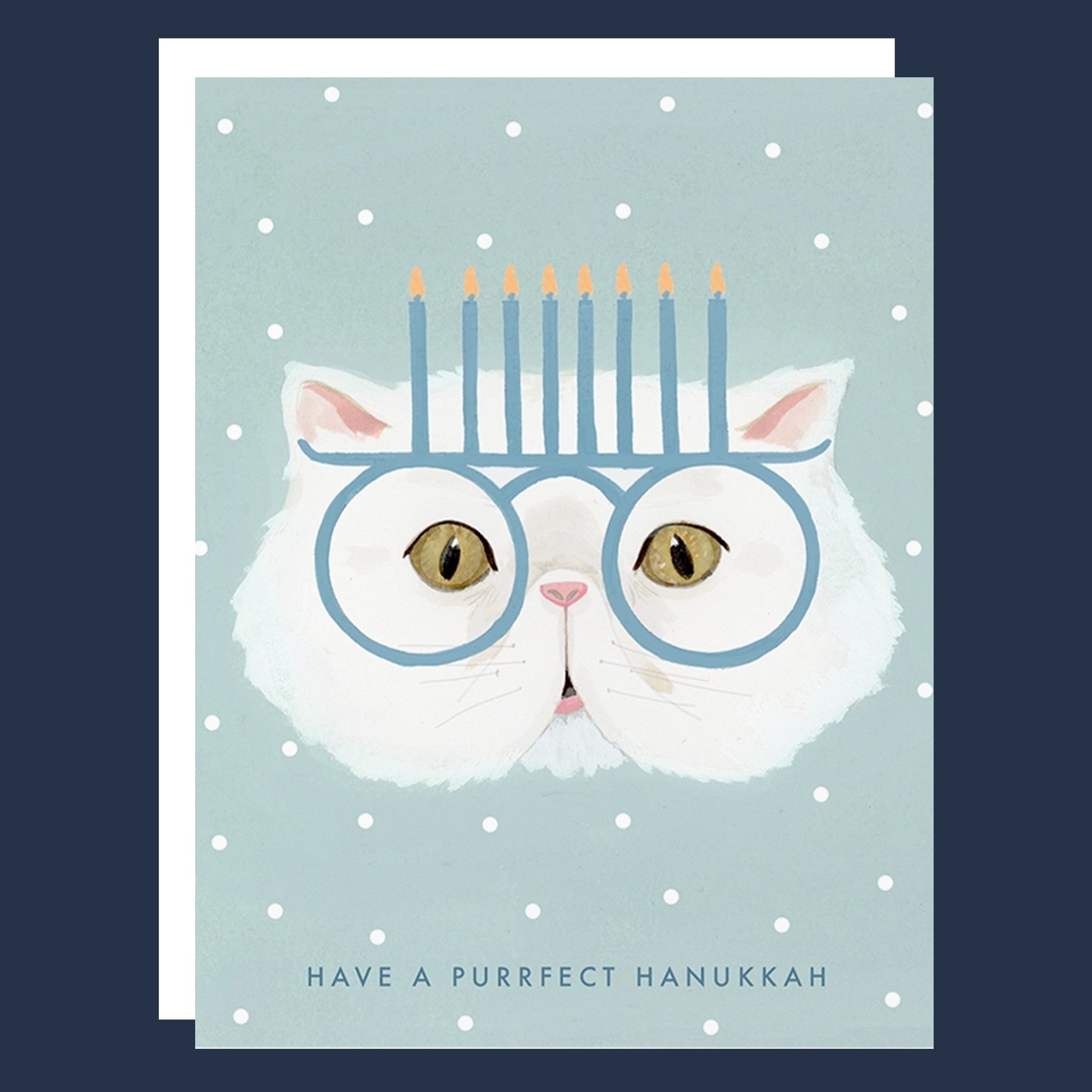 A light blue card with an illustration of a white cat with a menorah glasses on and text that reads, 'Have A Purrfect Hanukkah'. 