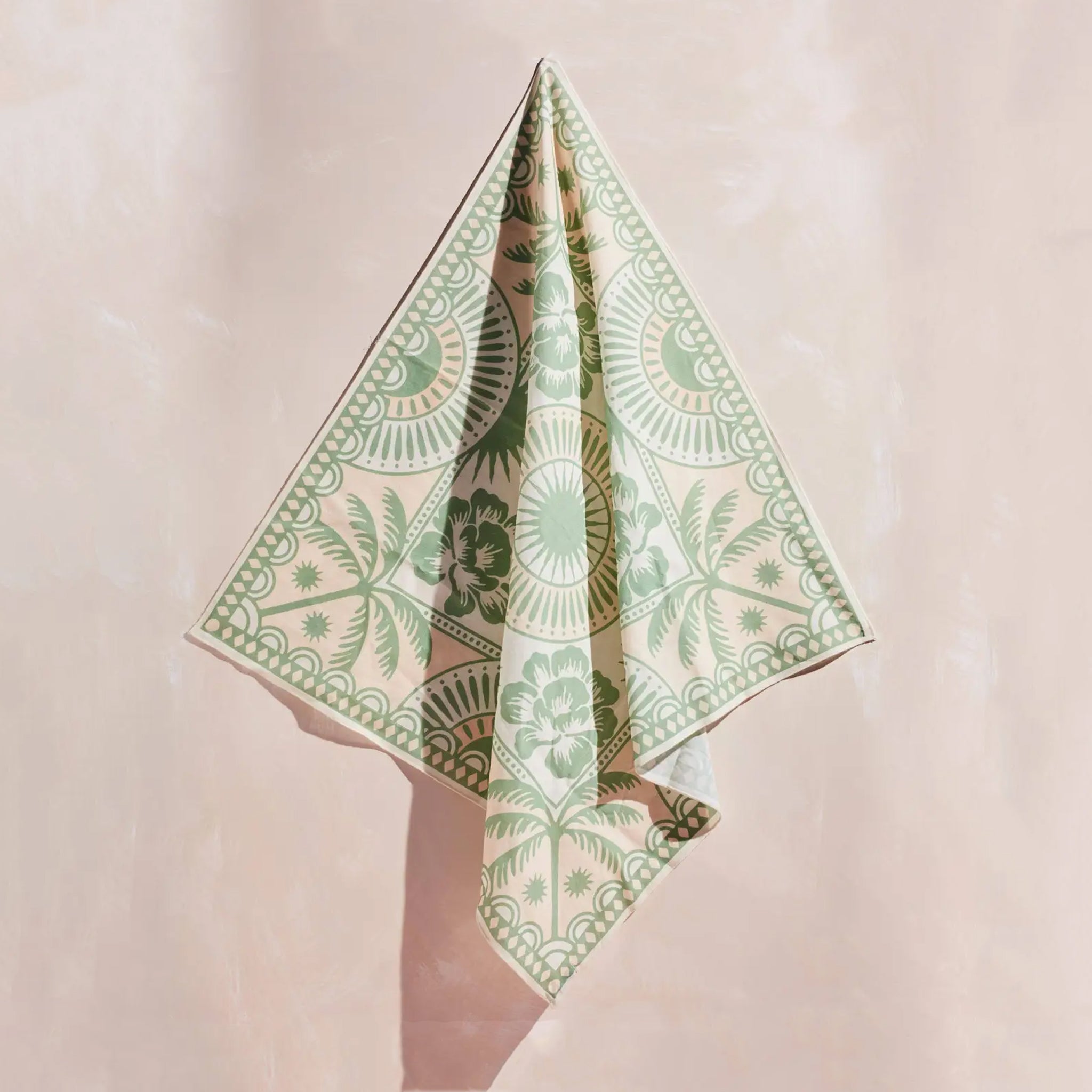 A green tropical pattern bandana. 