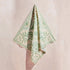 A green tropical pattern bandana. 