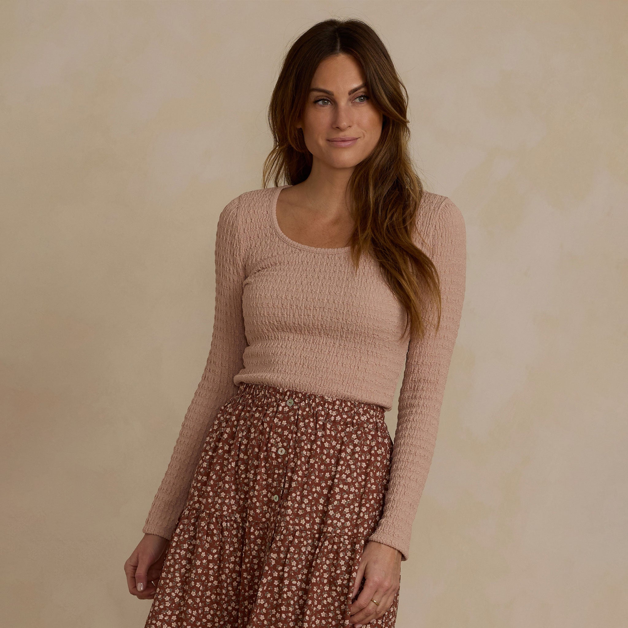 woman modeling rose colored long sleeve shirt