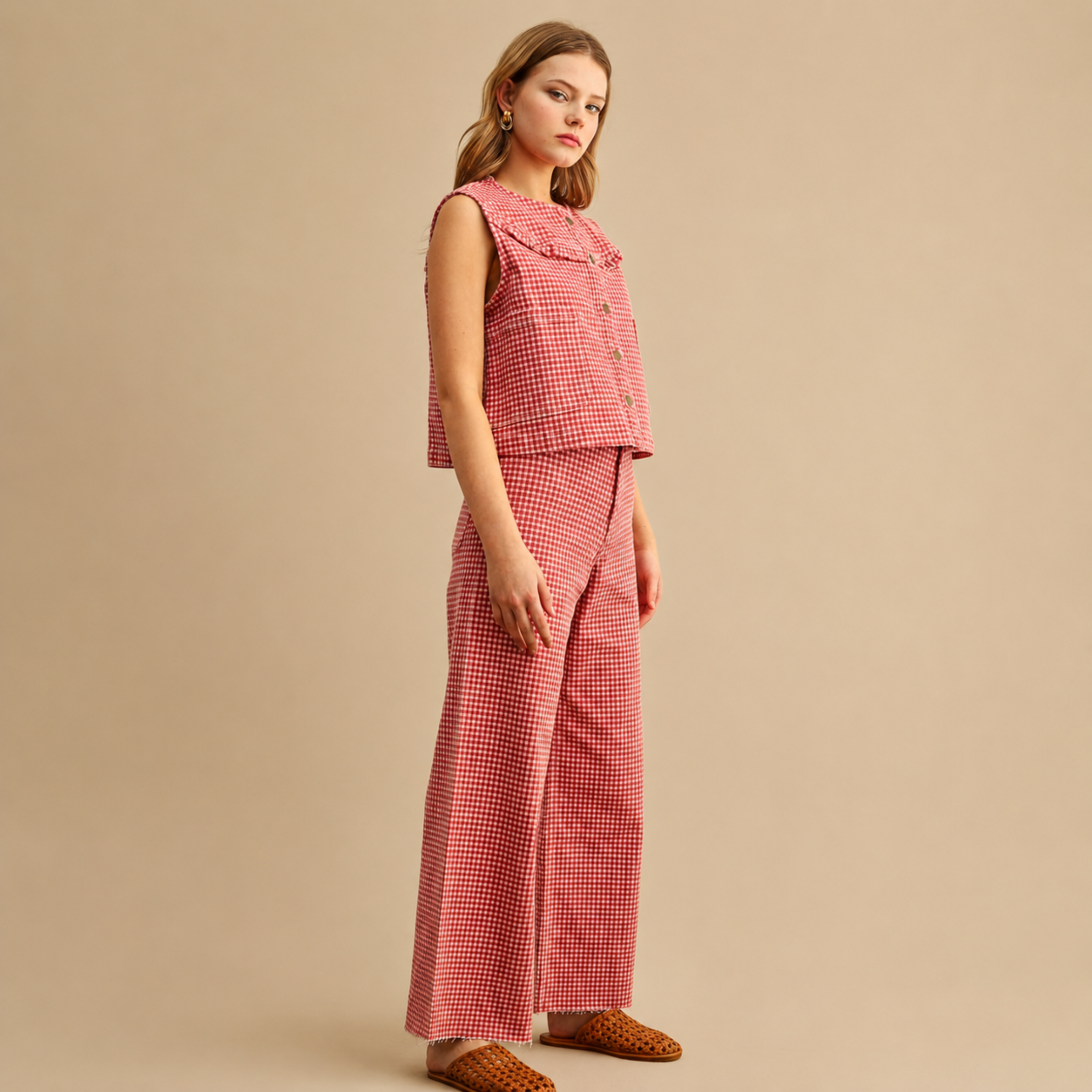  a red gingham pair of pants with pockets on the back. 