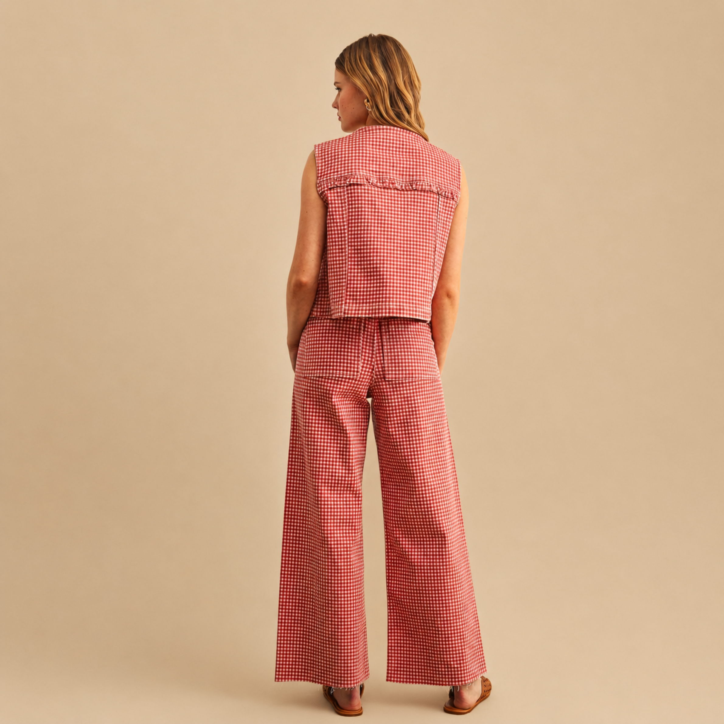  a red gingham pair of pants with pockets on the back. 