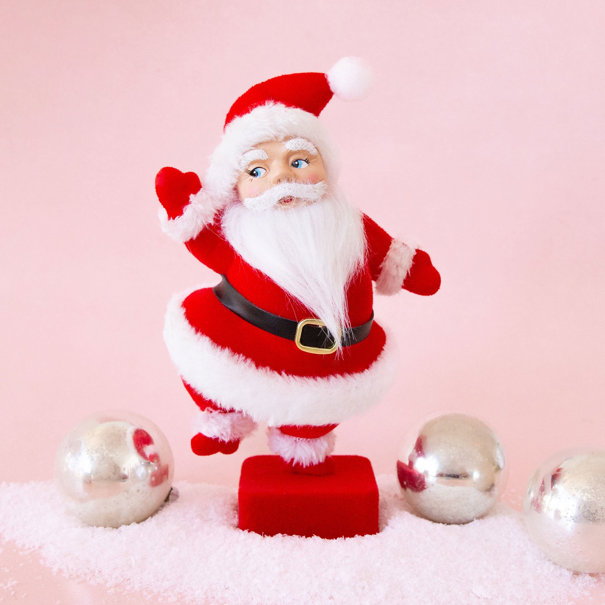 A red and white Santa figurine. 