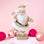 A gold glitter Santa figurine. 