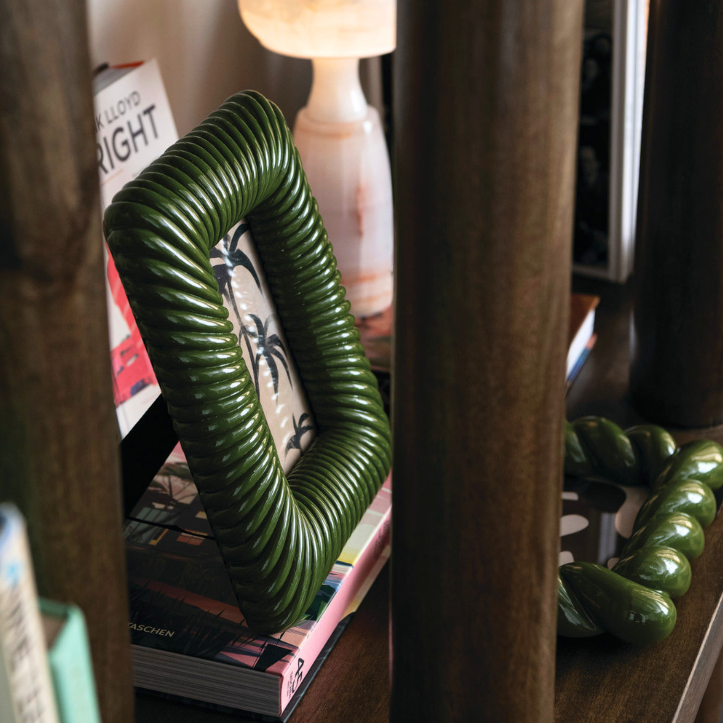 a ribbed green picture frame. 