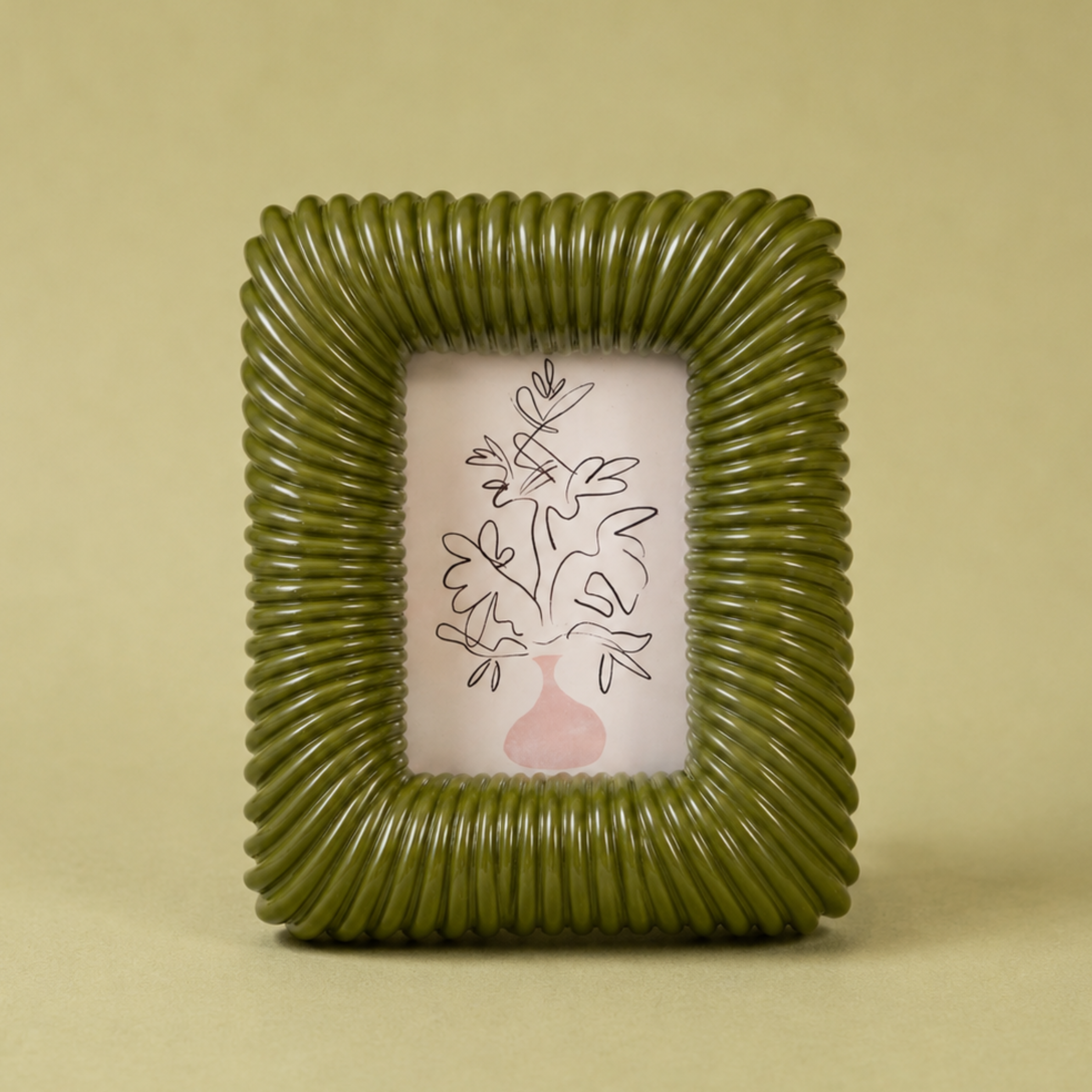 a ribbed green picture frame. 