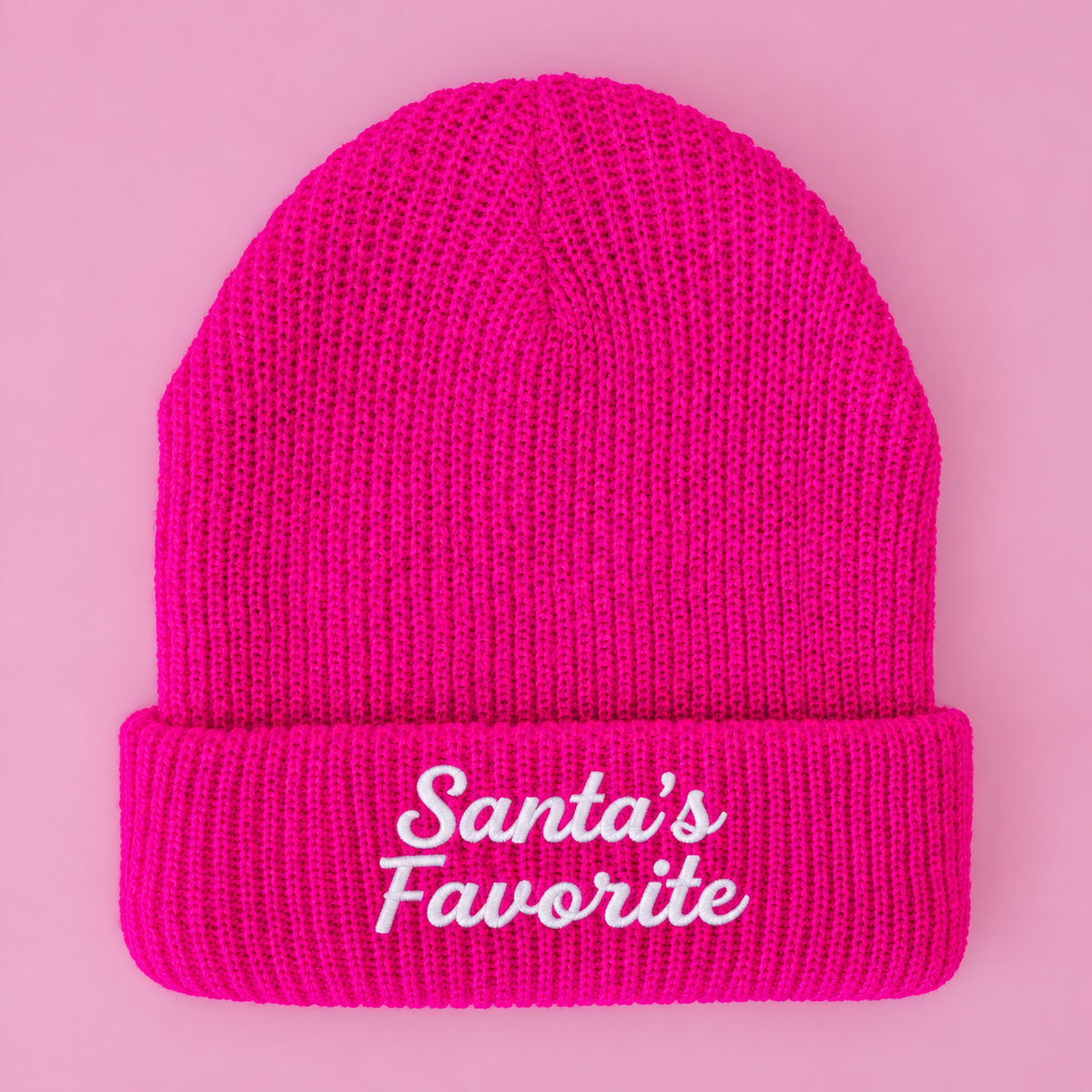 A hot pink beanie with "Santa's Favorite" embroidered on it.