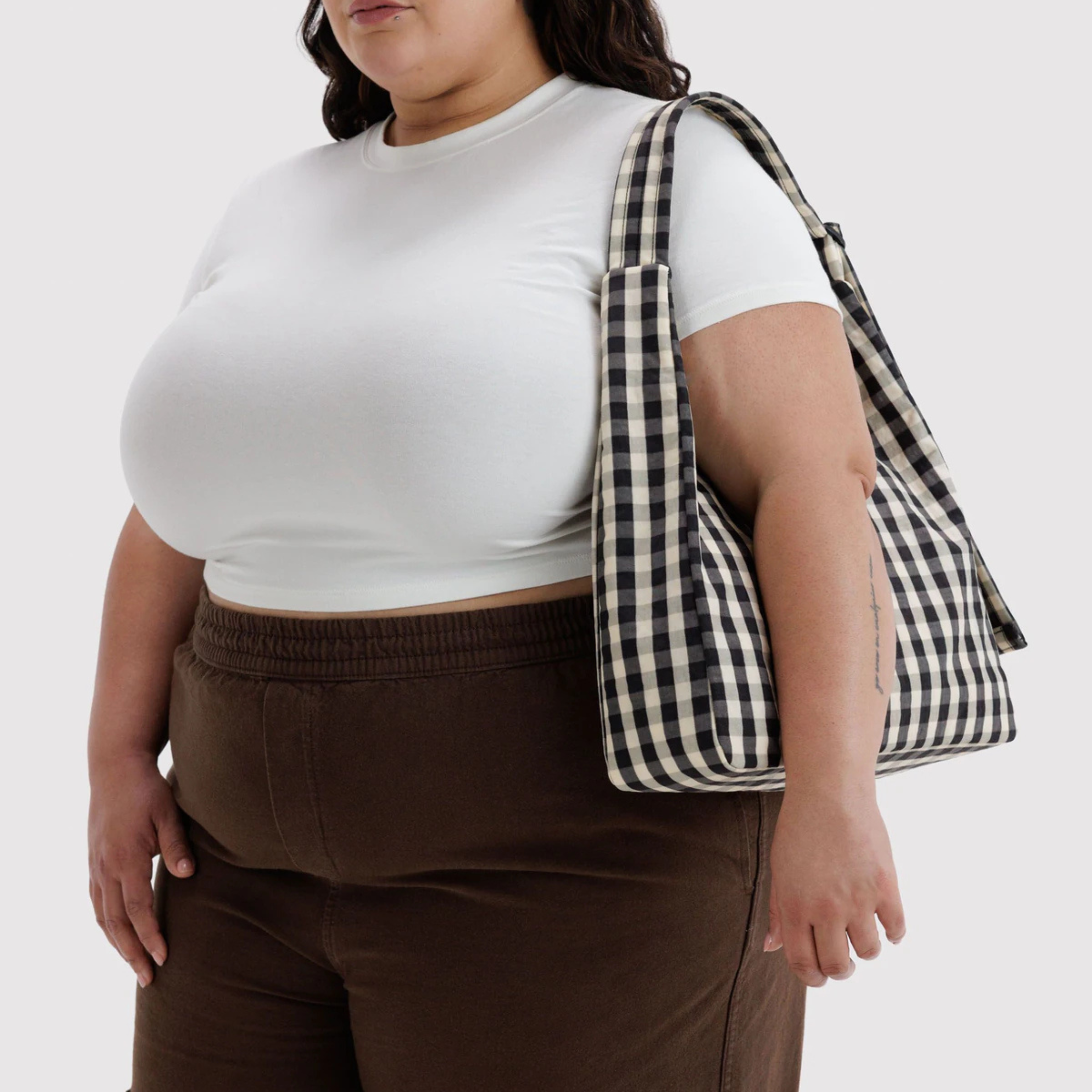 A black and cream gingham shoulder bag.