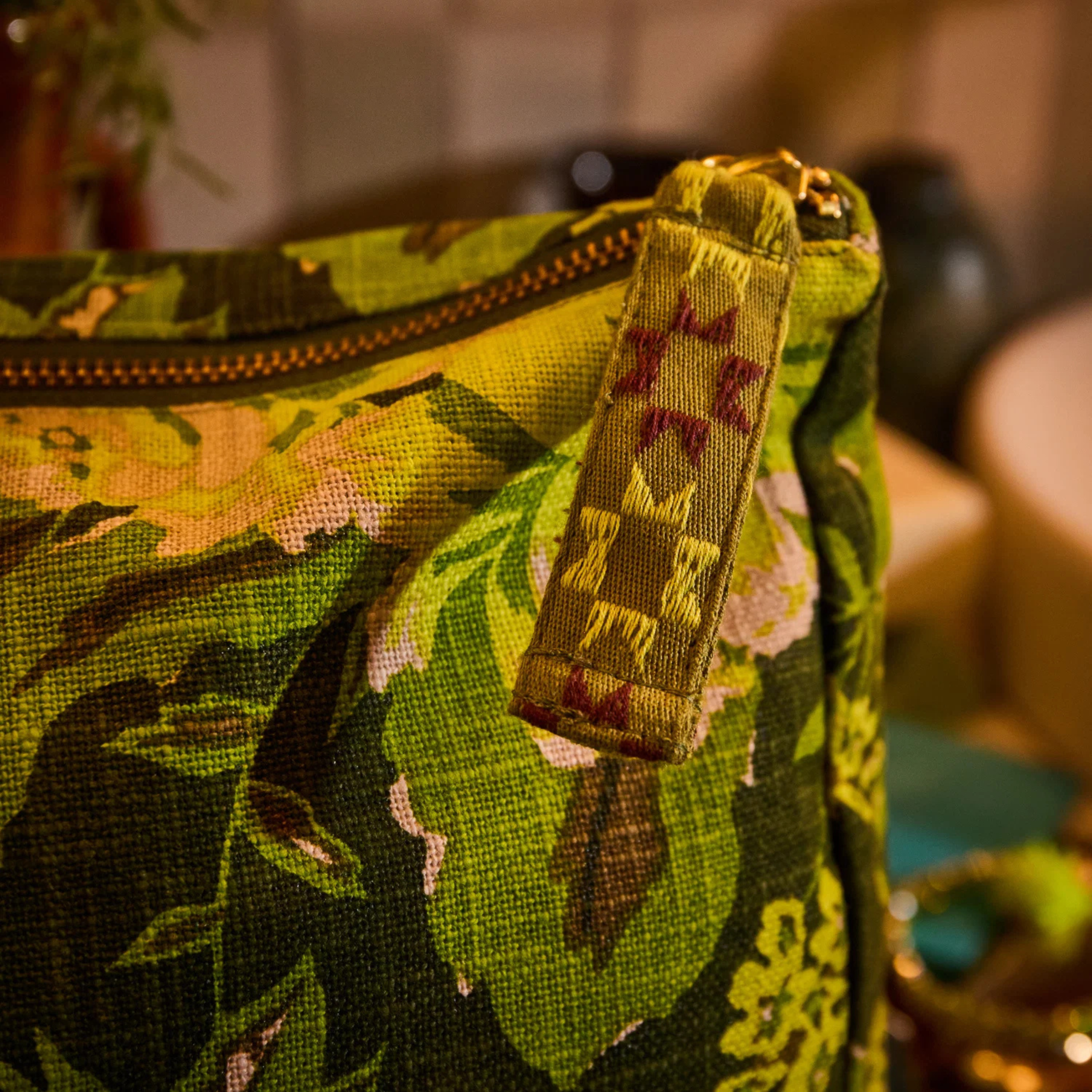a green floral print cosmetic bag. 