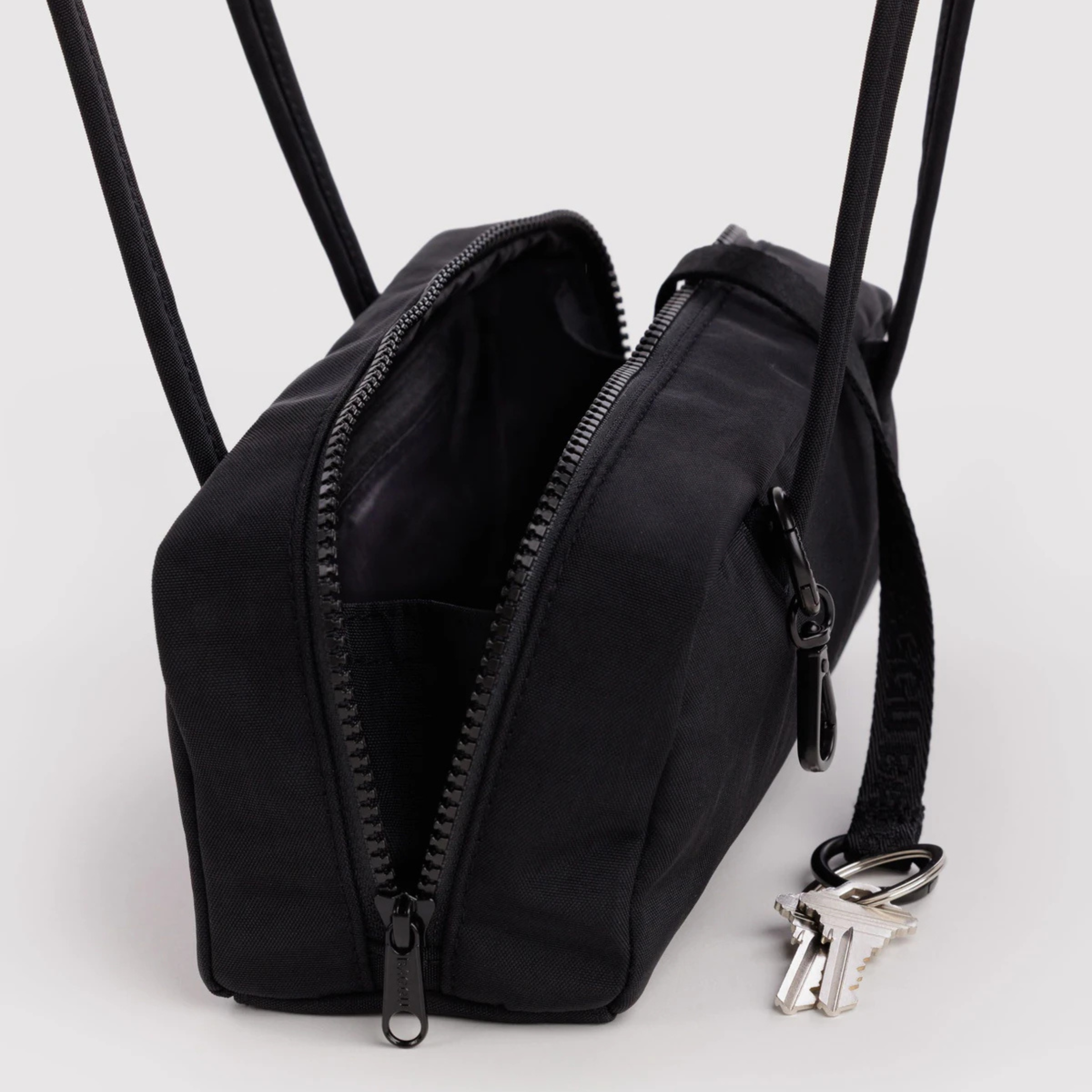 A black nylon shoulder bag.
