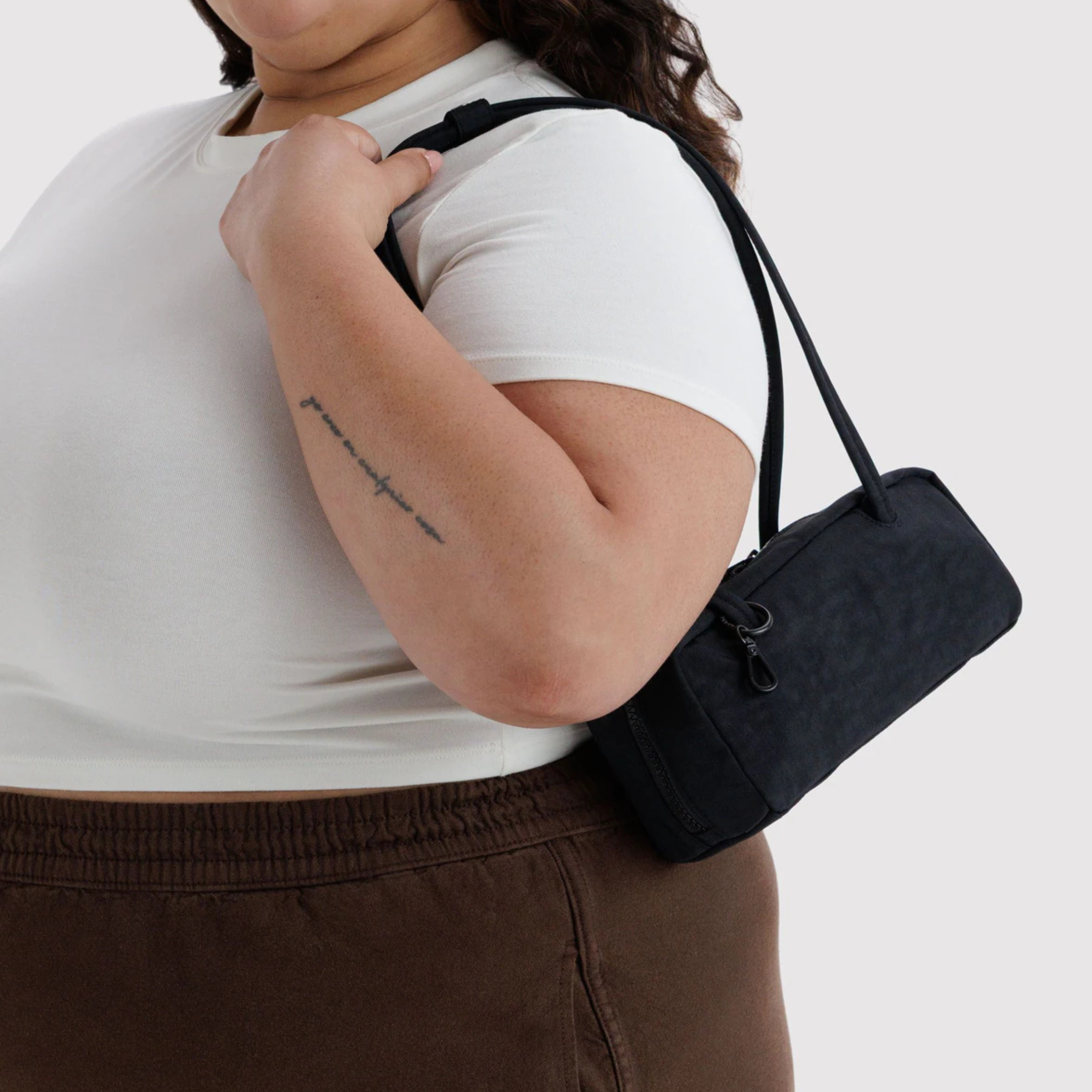 A black nylon shoulder bag.