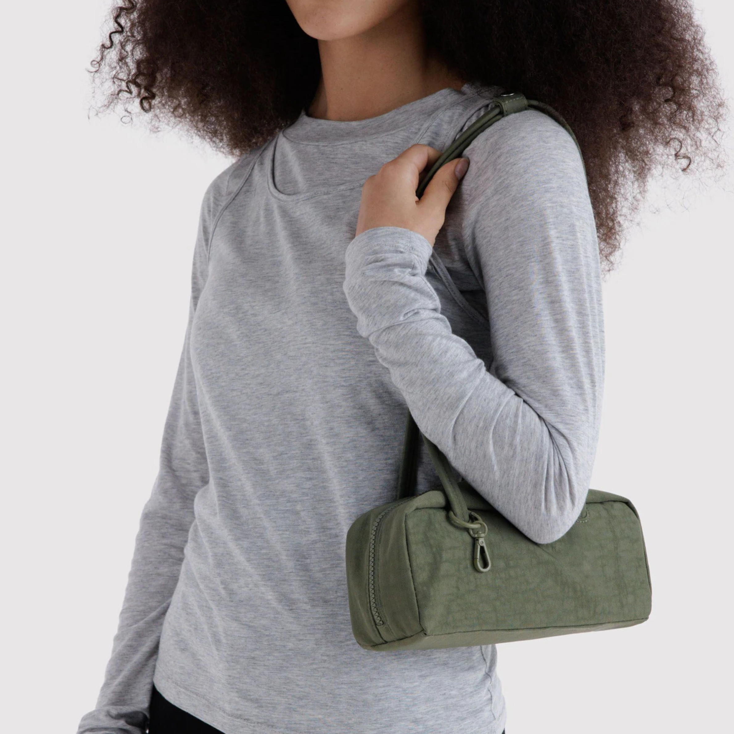 A green nylon shoulder bag.