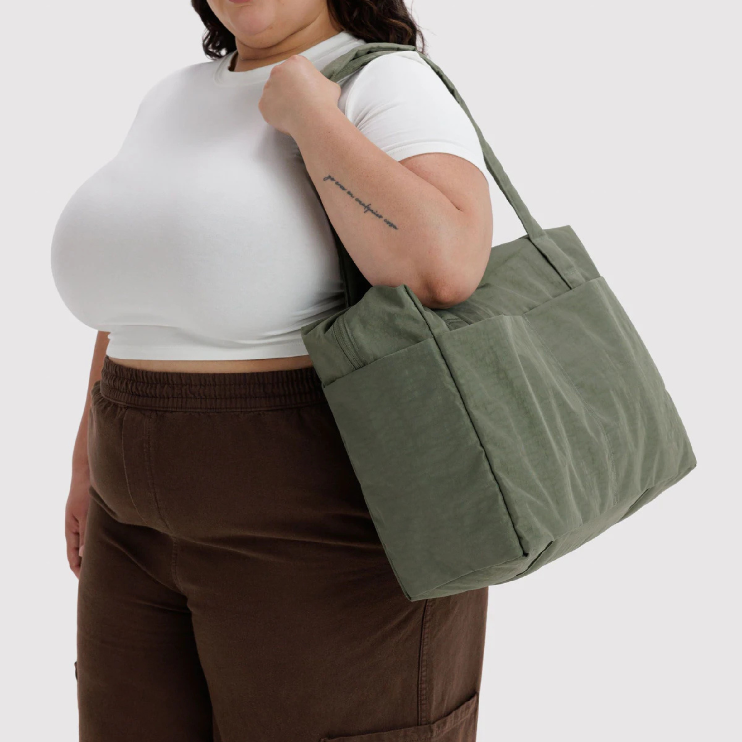 A green nylon small carry on bag.