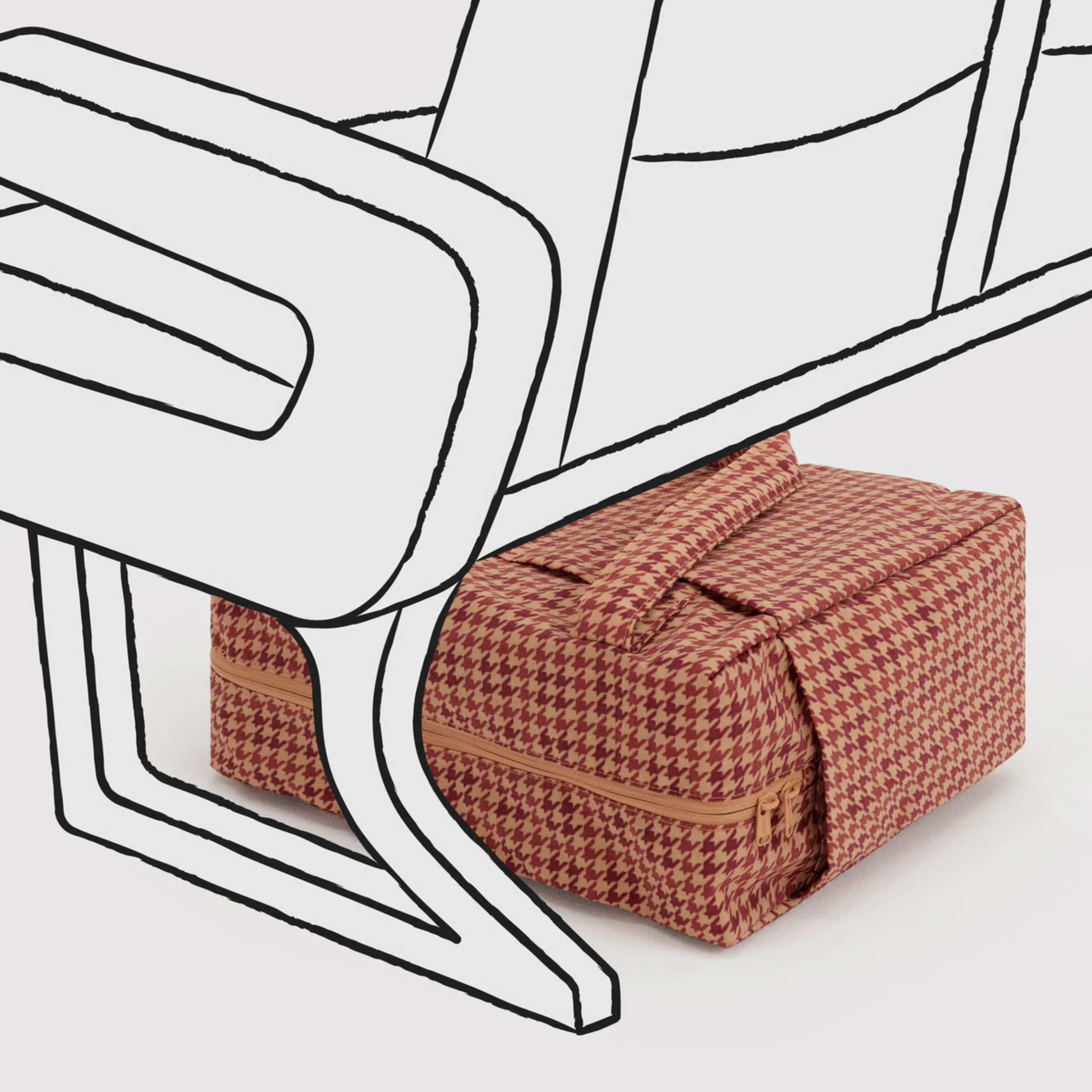 A tan and rust colored printed nylon carry on bag.
