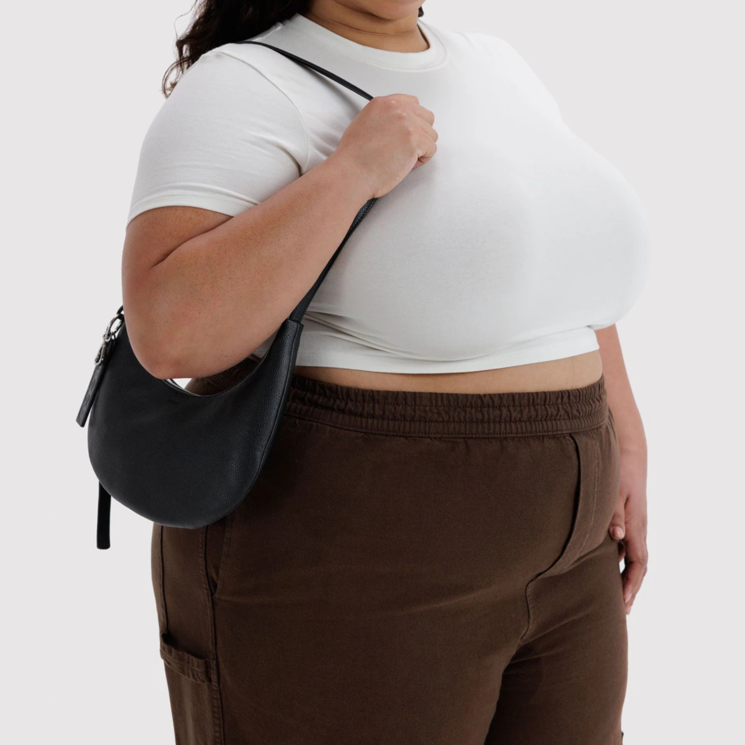 A black leather shoulder bag. 