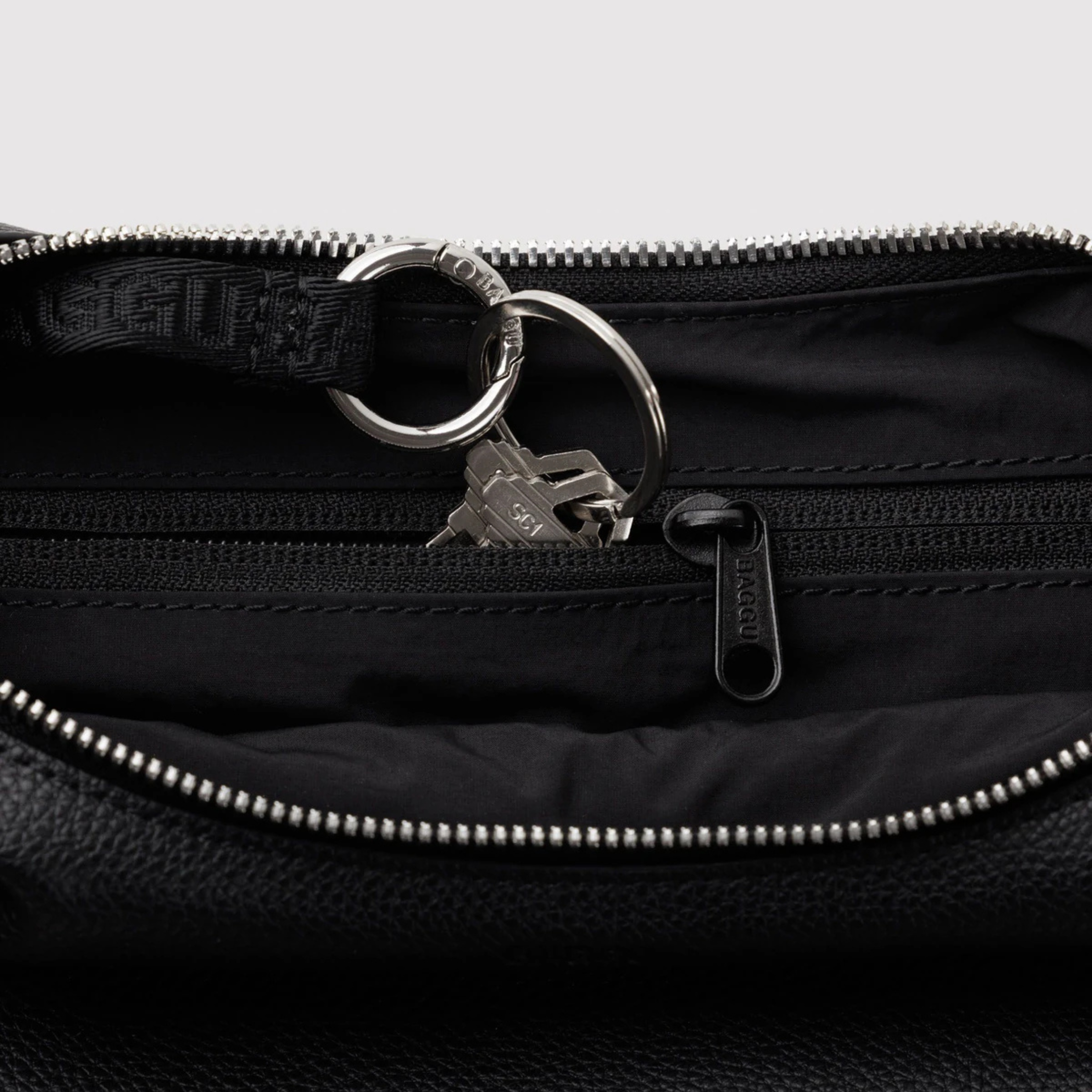 A black leather shoulder bag. 