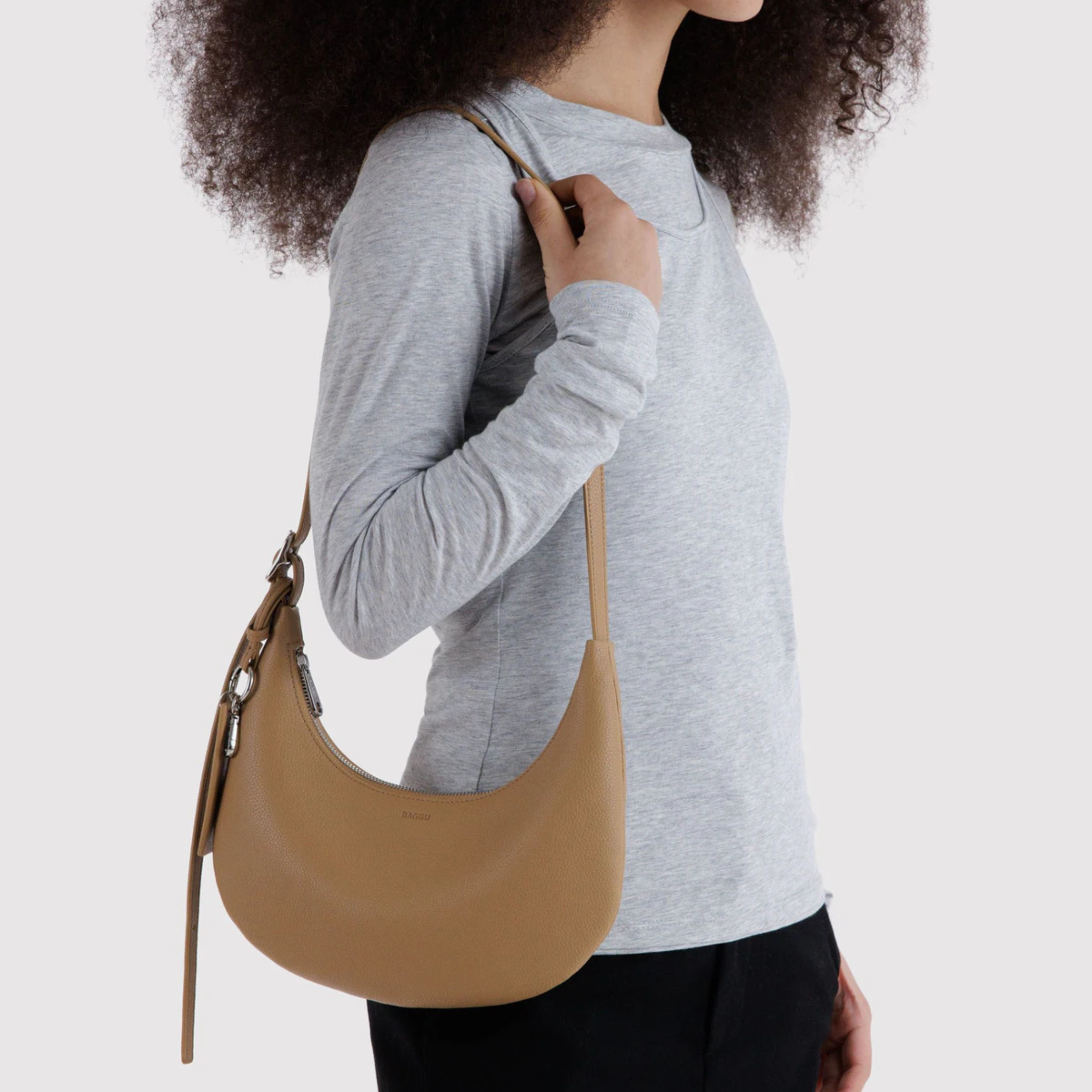 A tan leather handbag. 