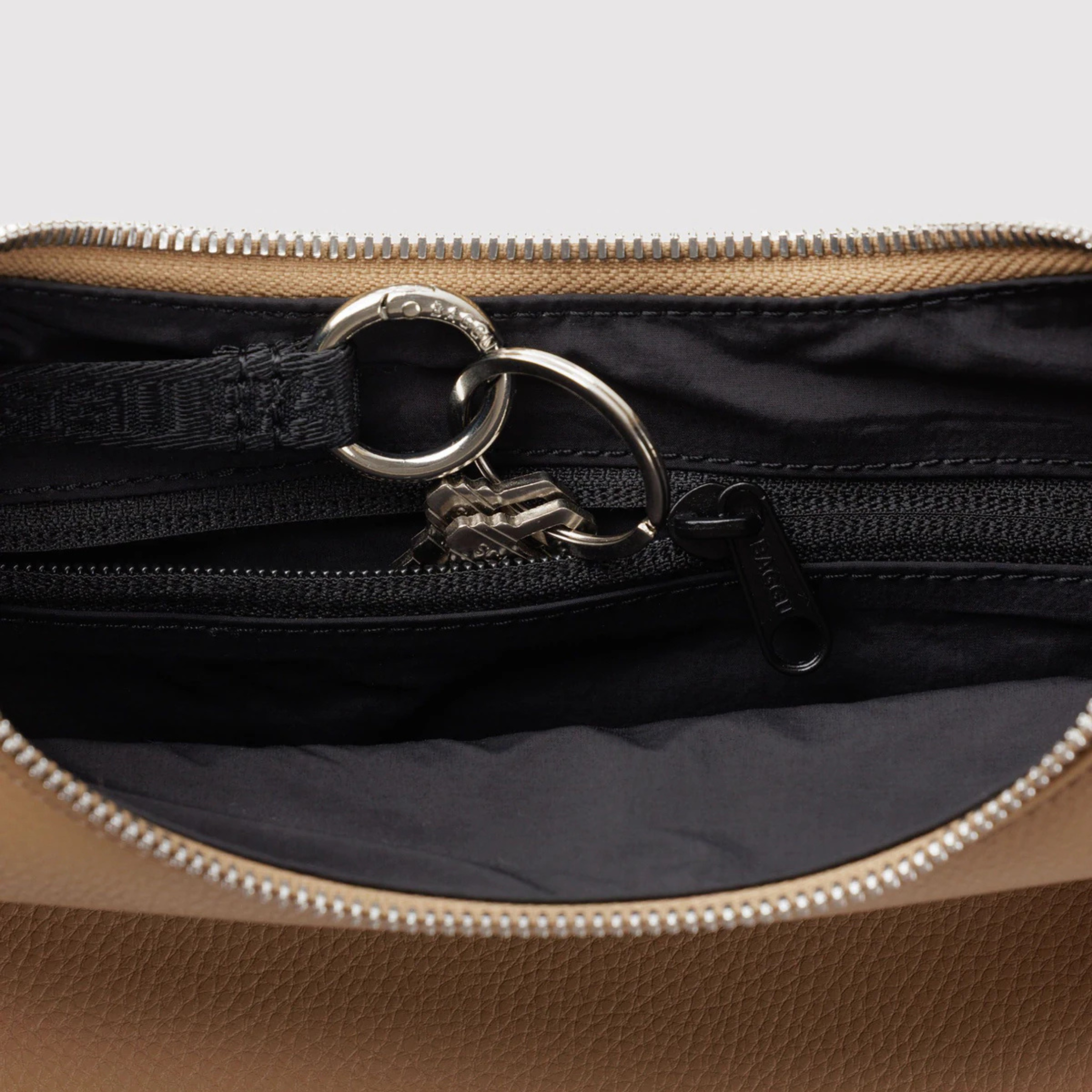 A tan leather handbag. 