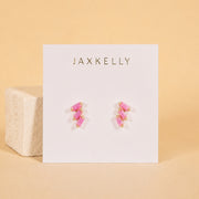 A pink offset trio stud earring. 