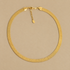 a gold snake chain necklace. 