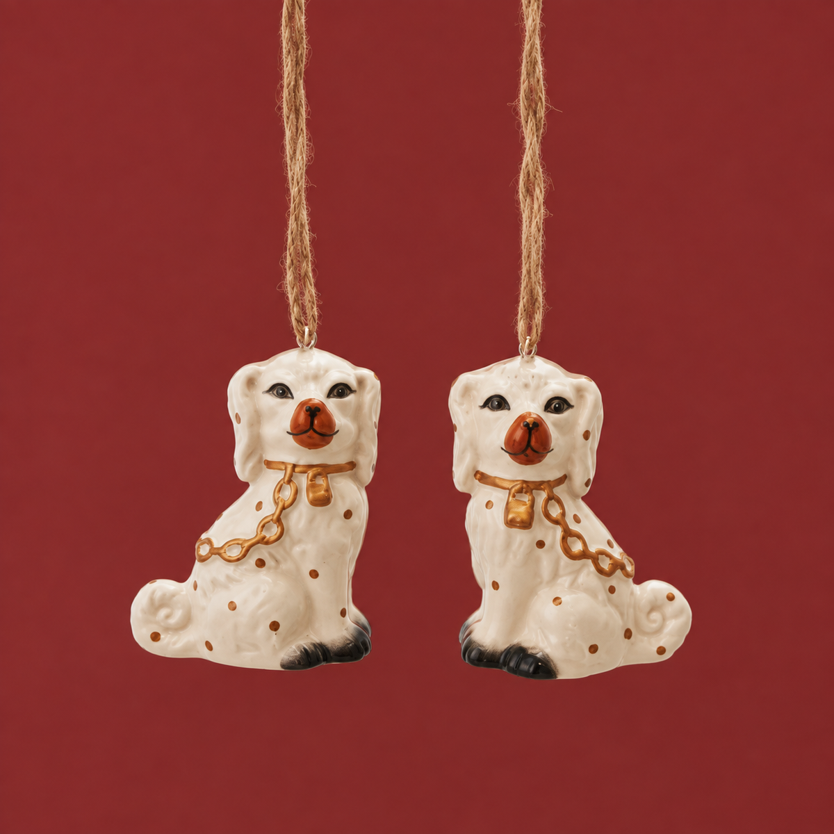 white ceramic ornaments of a staffordshire dog.