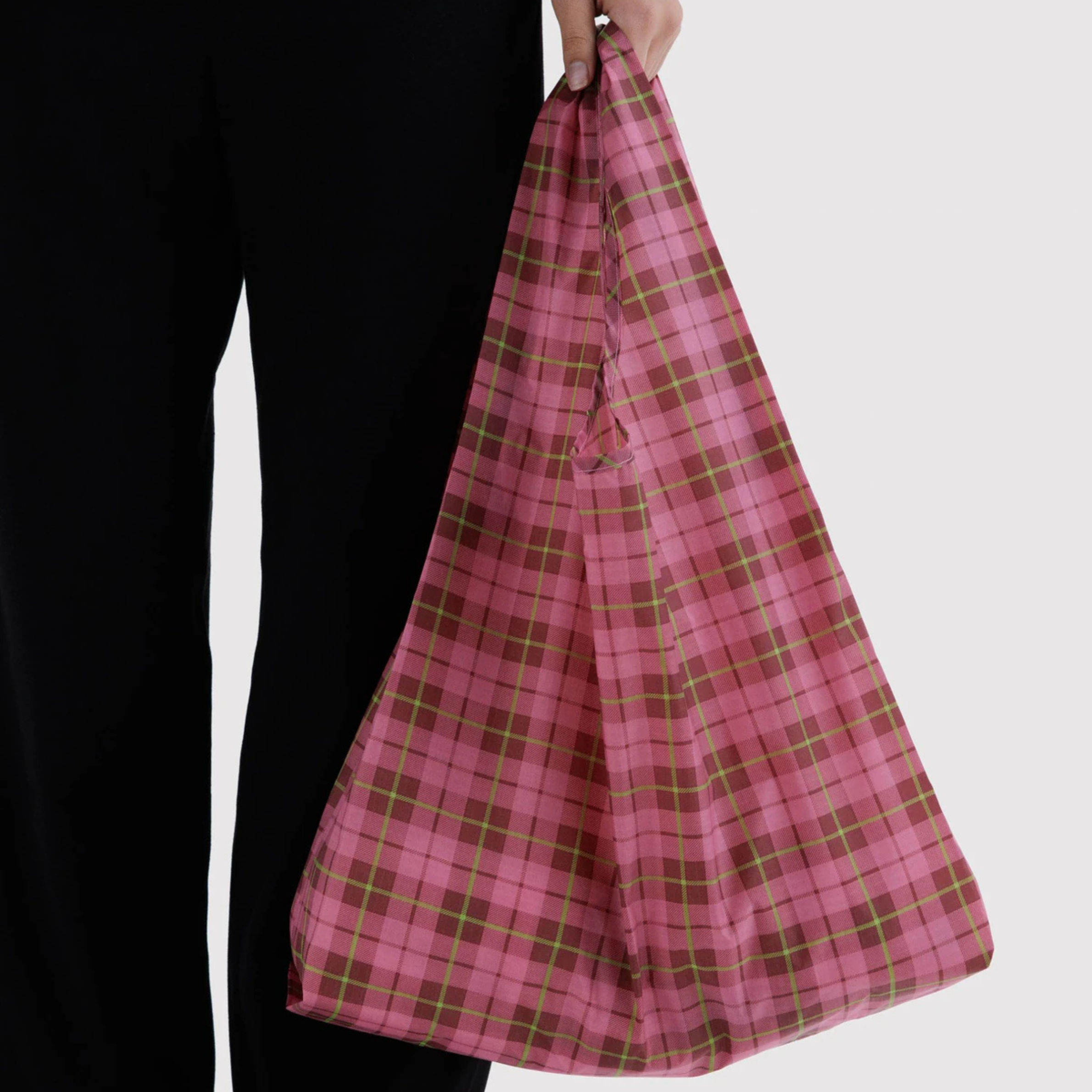 A pink and light green plaid nylon tote bag.
