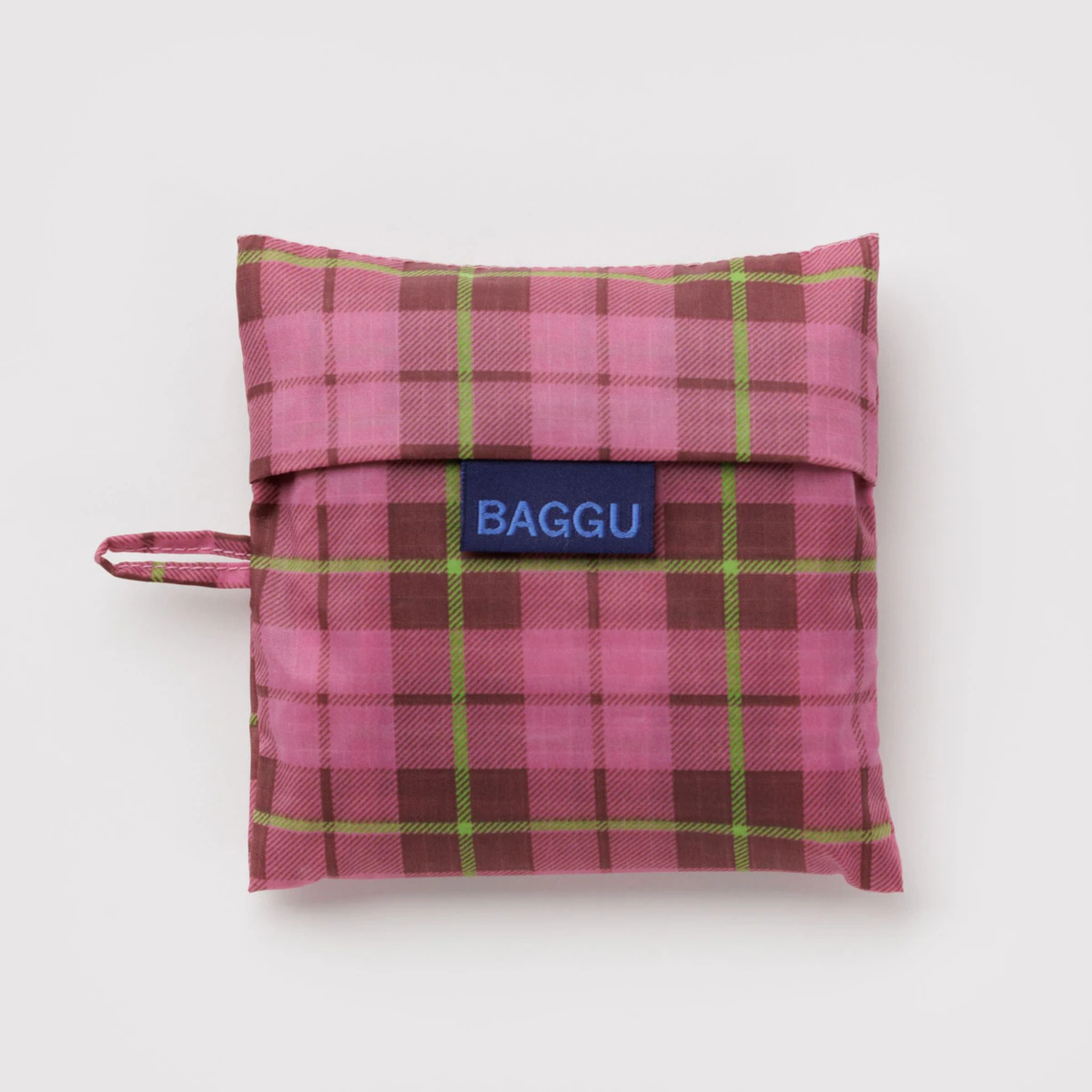 A pink and light green plaid nylon tote bag.